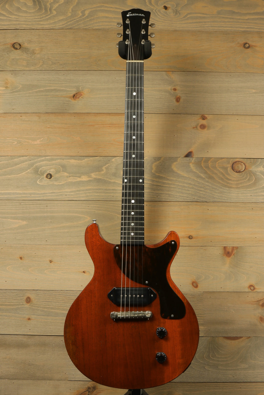 Eastman SB55DC/v electric guitar in natural finish, front view showcasing its sleek design