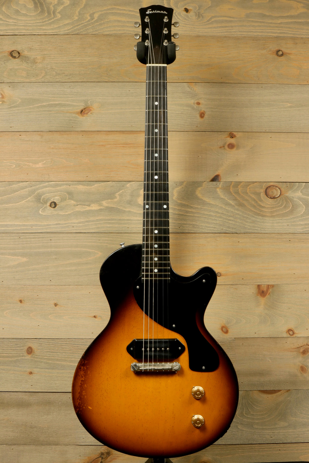 Eastman SB55/v-SB sunburst electric guitar, front view showcasing its vintage appeal