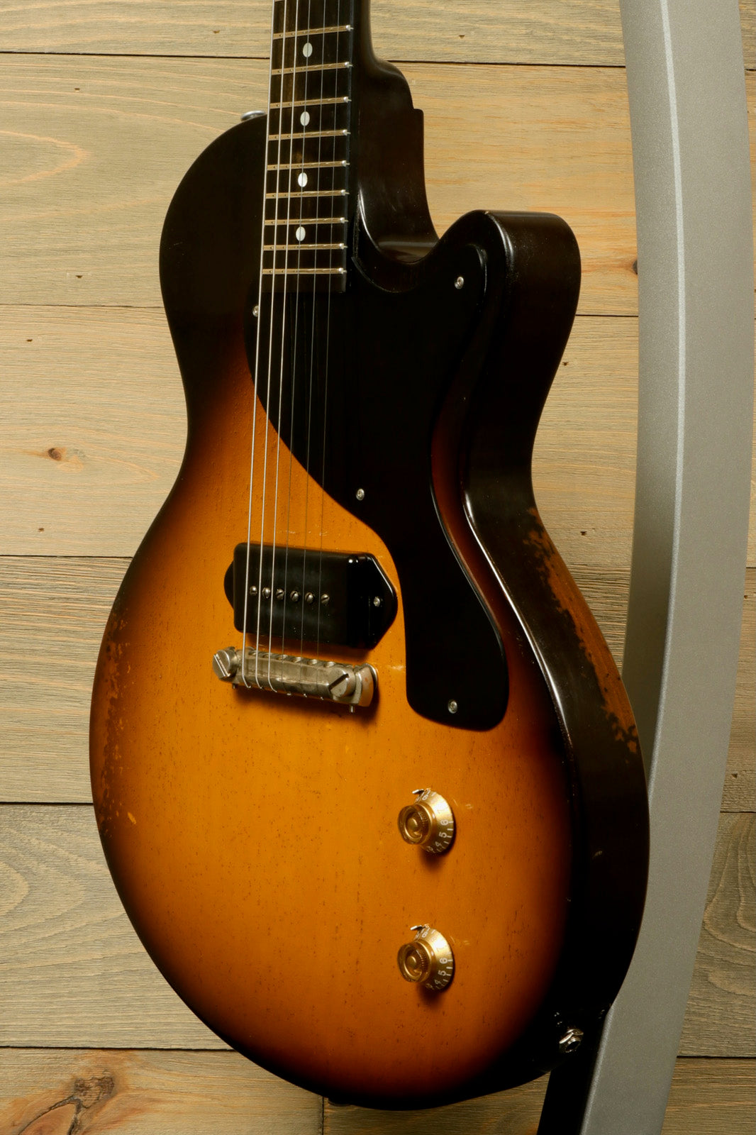 Eastman SB55/v-SB electric guitar in sunburst finish, side view showcasing body and hardware