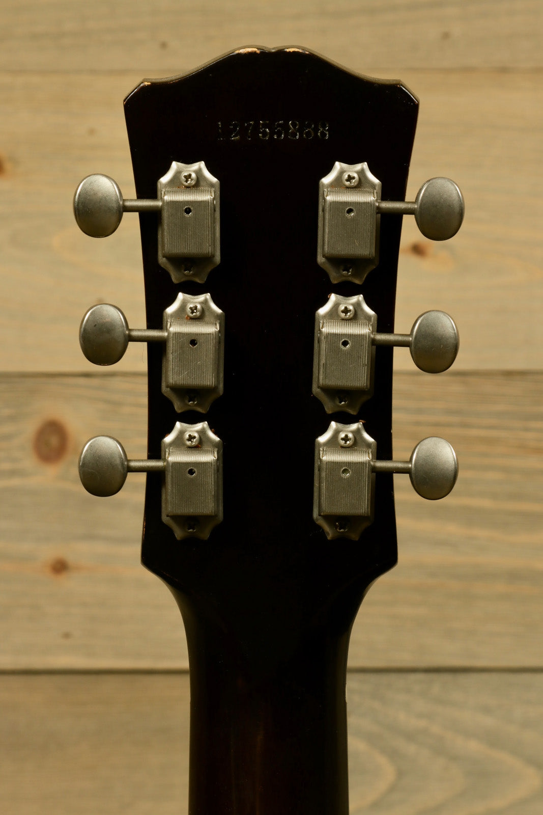 Eastman SB55/v-SB electric guitar, back view, showing tuning pegs and dark finish