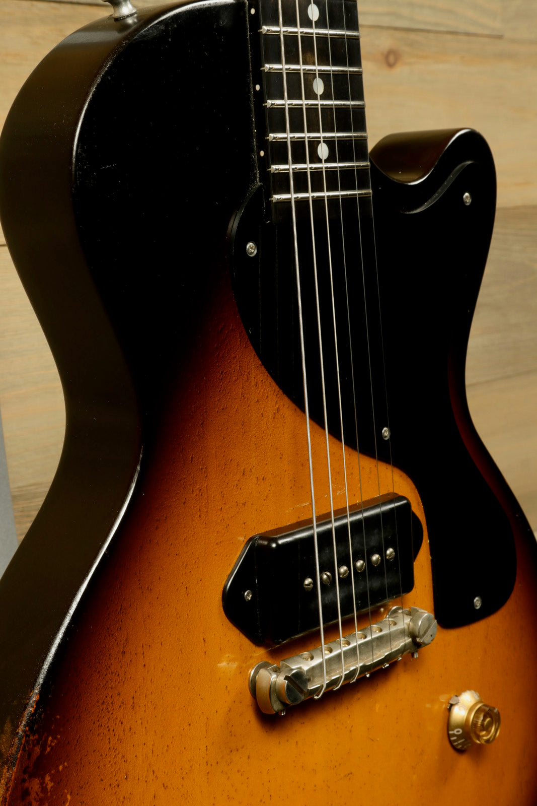 Eastman SB55/v-SB electric guitar in sunburst finish, close-up view of body and neck
