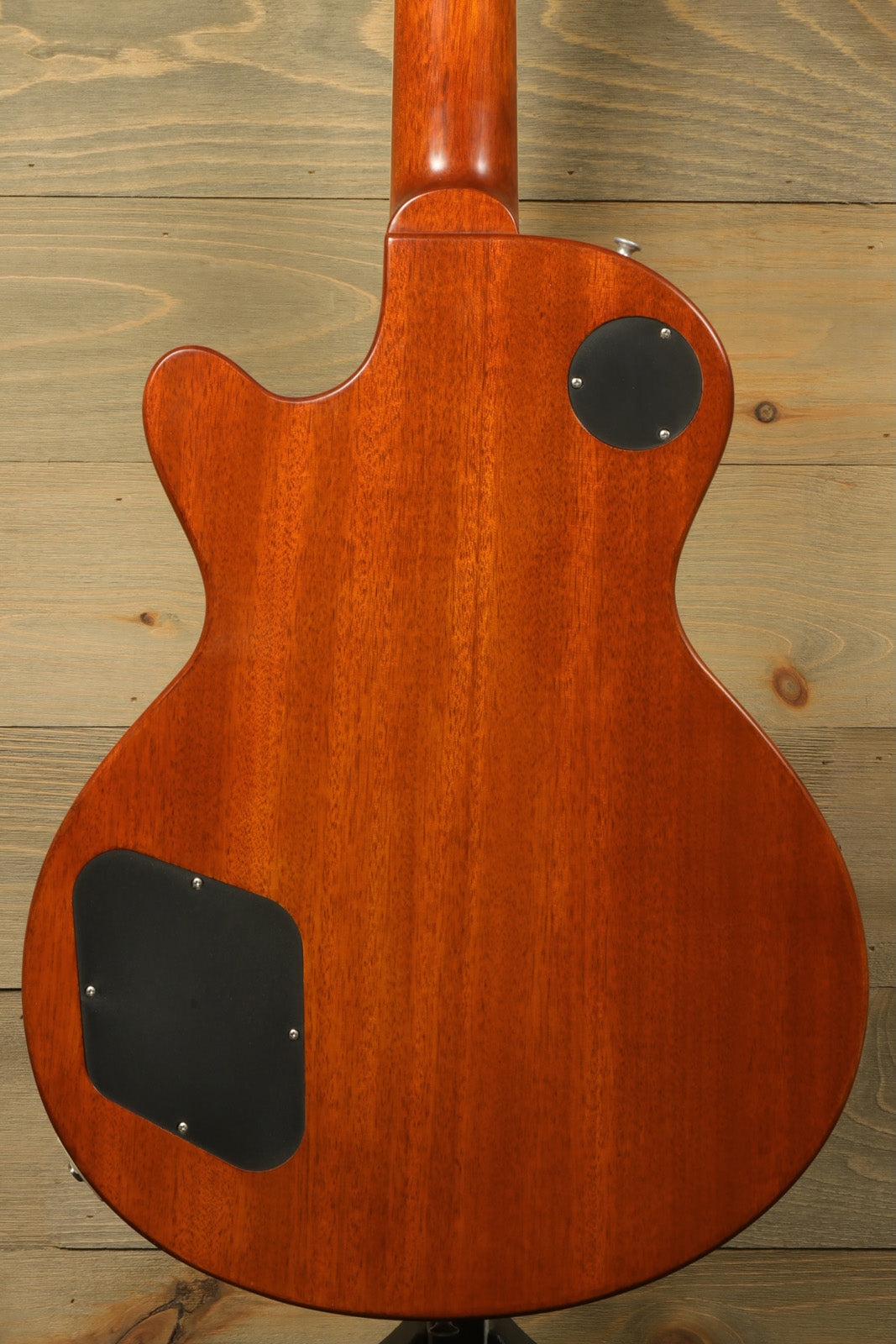 Eastman SB56/TV-AMB electric guitar in amber finish, back view showcasing the wood grain.