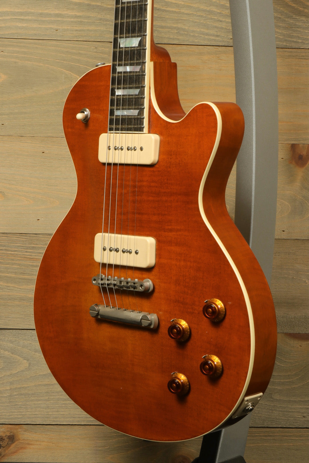 Eastman SB56/TV-AMB electric guitar in amber finish, front view showcasing body and hardware details