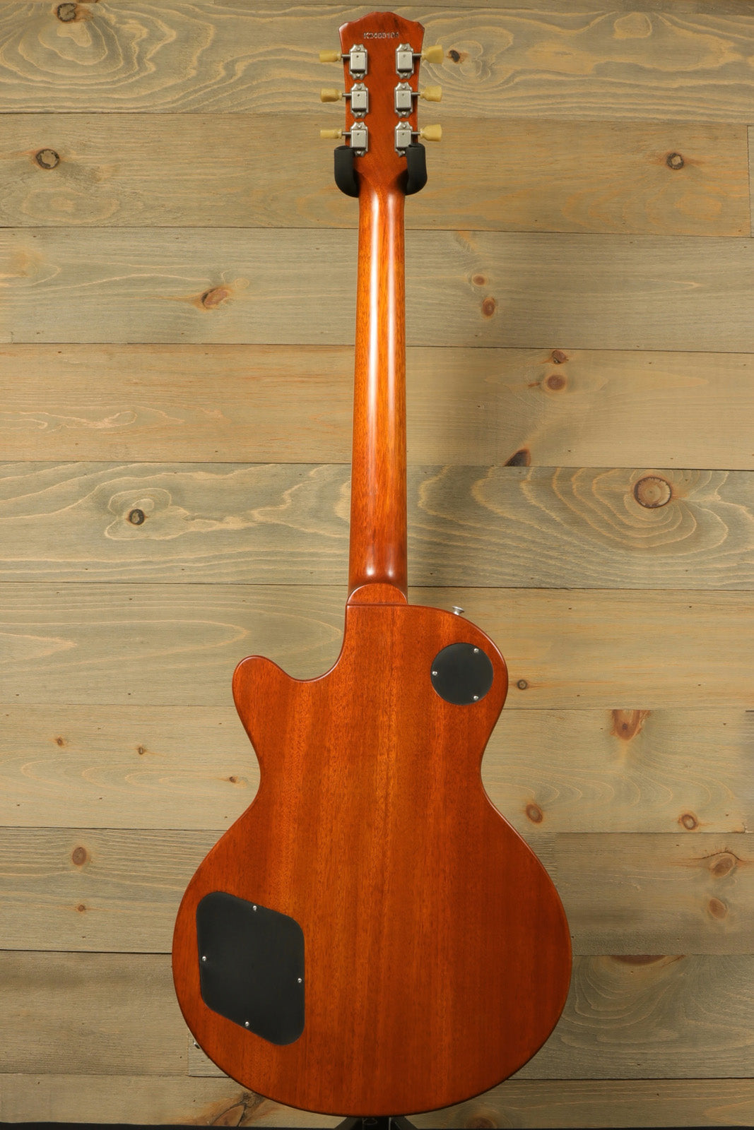 Eastman SB56/TV-AMB electric guitar in amber finish, back view showcasing the smooth mahogany body