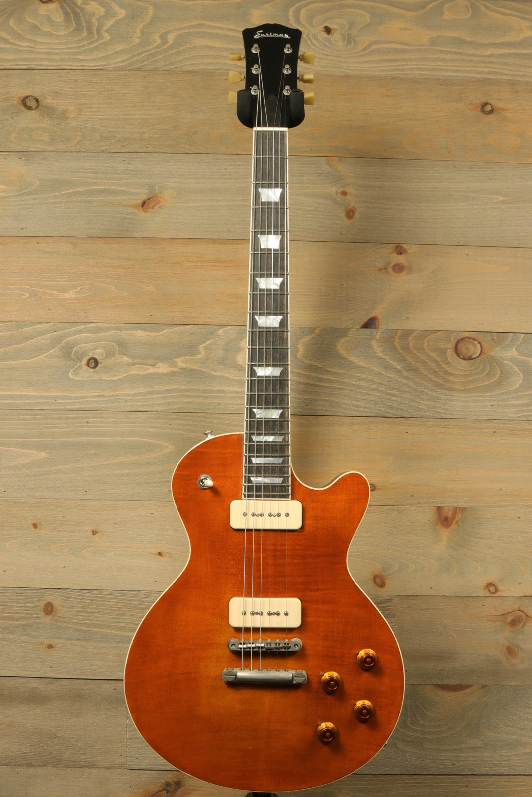 Eastman SB56/TV-AMB electric guitar in amber finish, front view with distinctive hardware