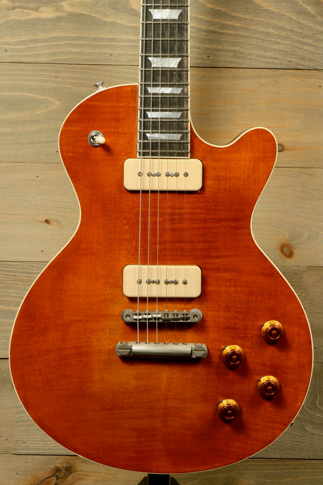 Eastman SB56/TV-AMB electric guitar in amber finish, front view showcasing pickups and controls