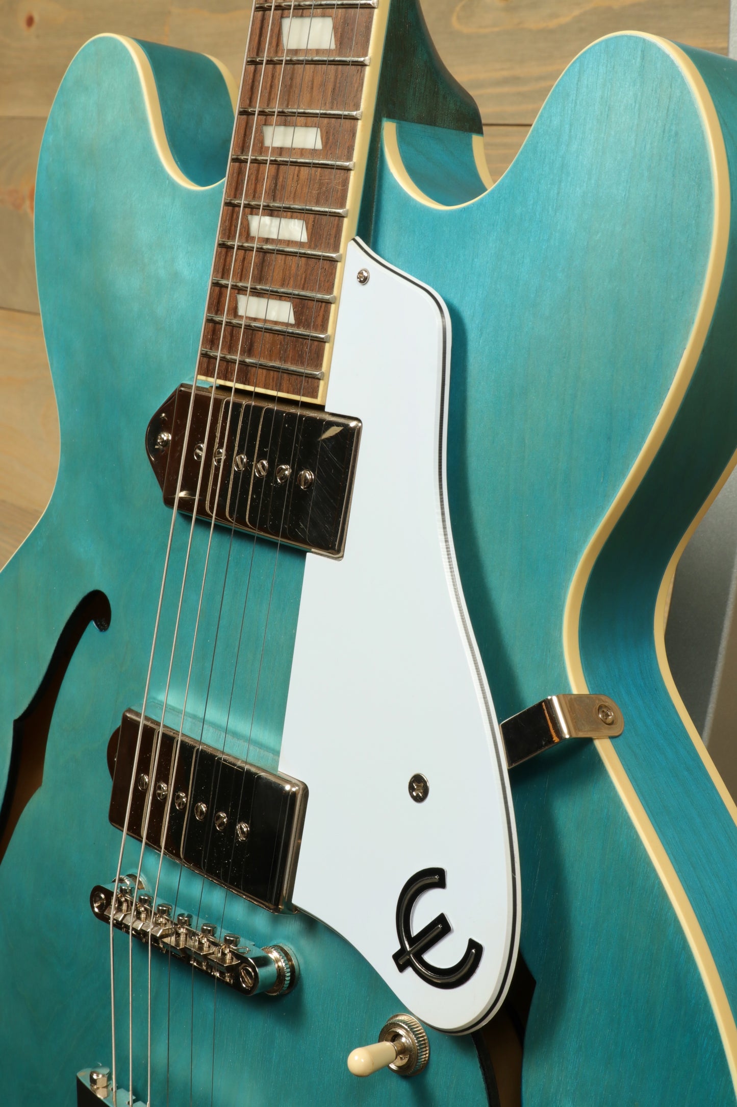 Epiphone Casino Worn electric guitar in turquoise blue, front view showcasing the body and neck