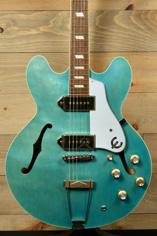 Epiphone Casino Worn in turquoise, front view showcasing the hollow body and vintage style pickups