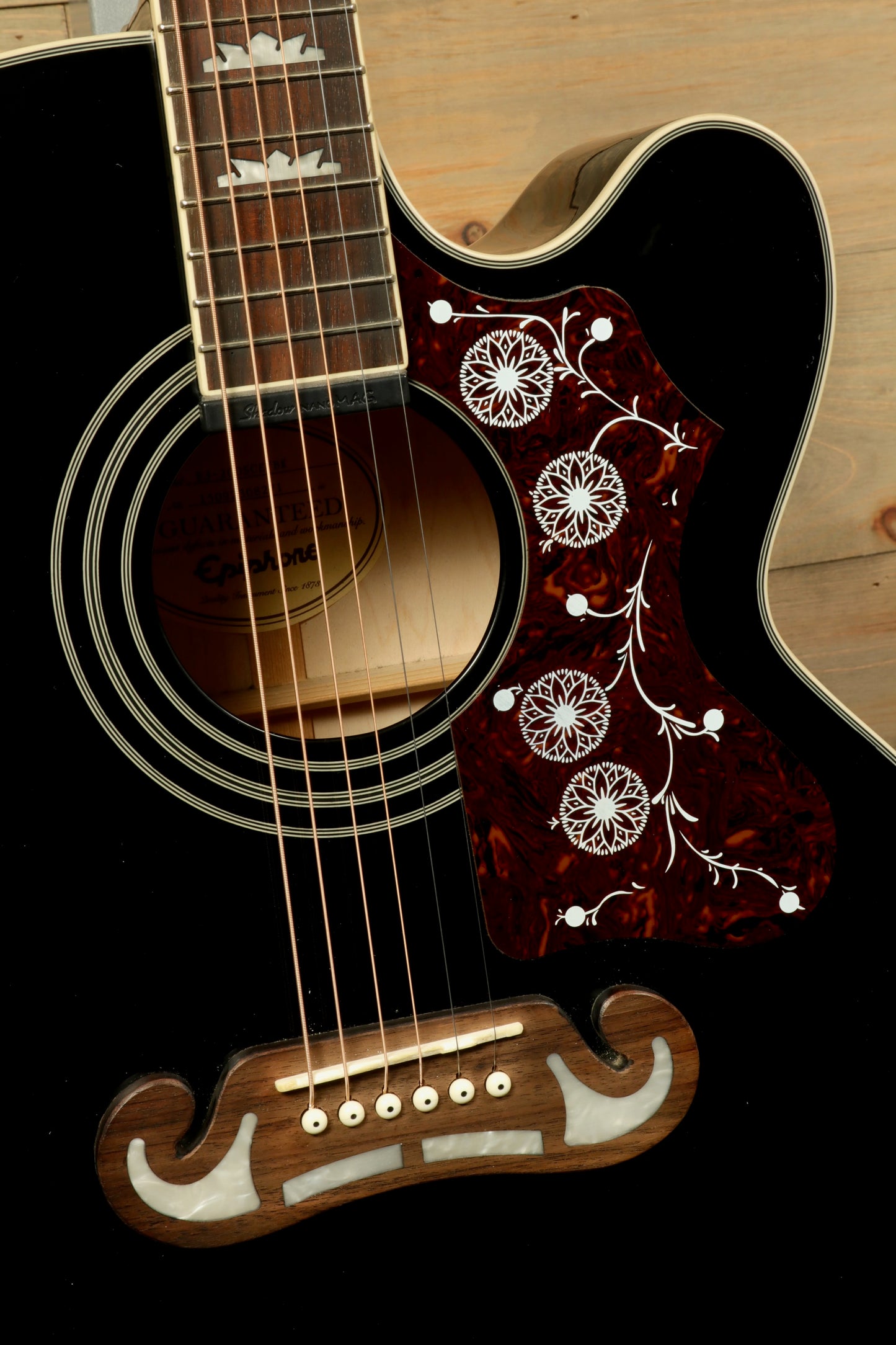 Close-up of Epiphone EJ200sce-BK USED Acoustic Electric Guitar with intricate inlays and a polished finish