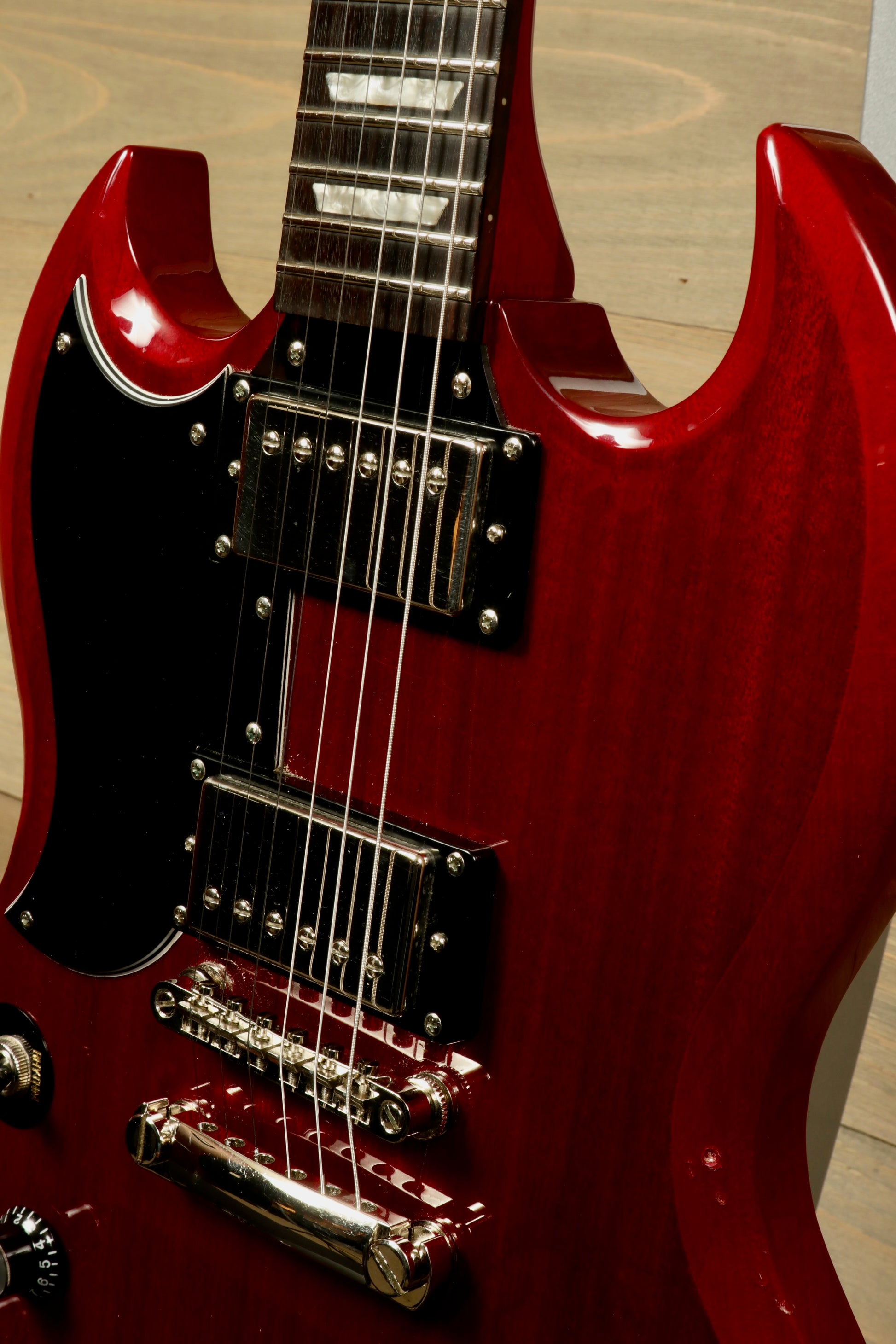 Epiphone SG Pro Left in vibrant red finish, showcasing the body and pickups, front view