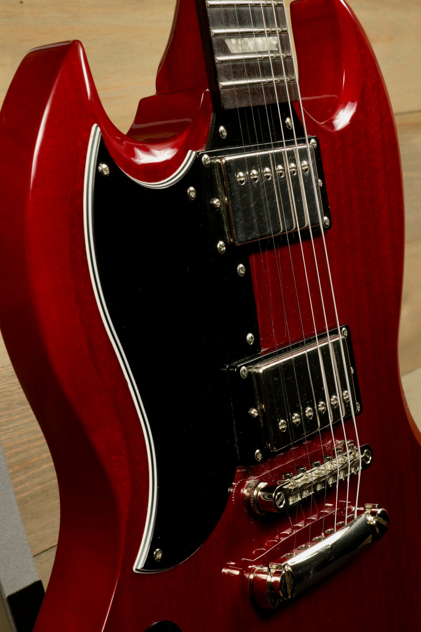 Epiphone SG Pro Left Cherry Red electric guitar, front view with chrome hardware and black pickguard