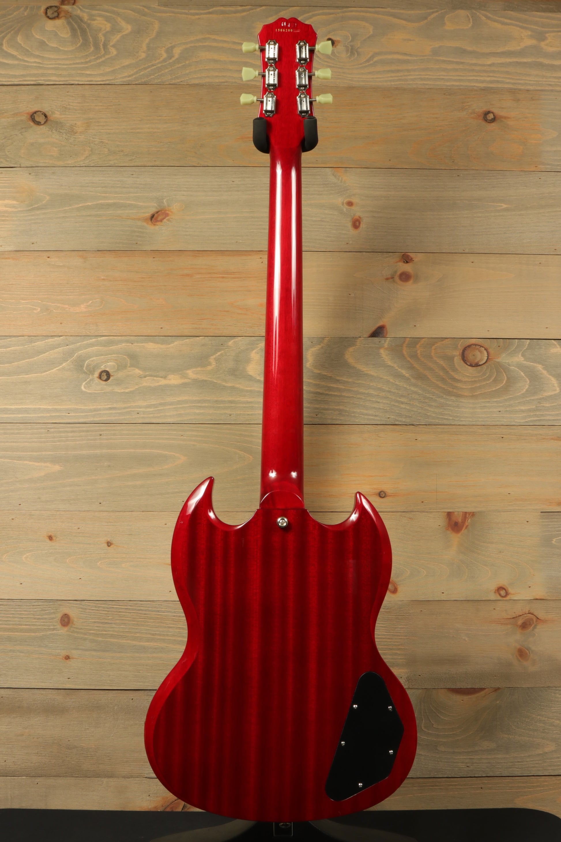 Epiphone SG Pro Left in cherry red, back view showcasing the striped finish and hardware