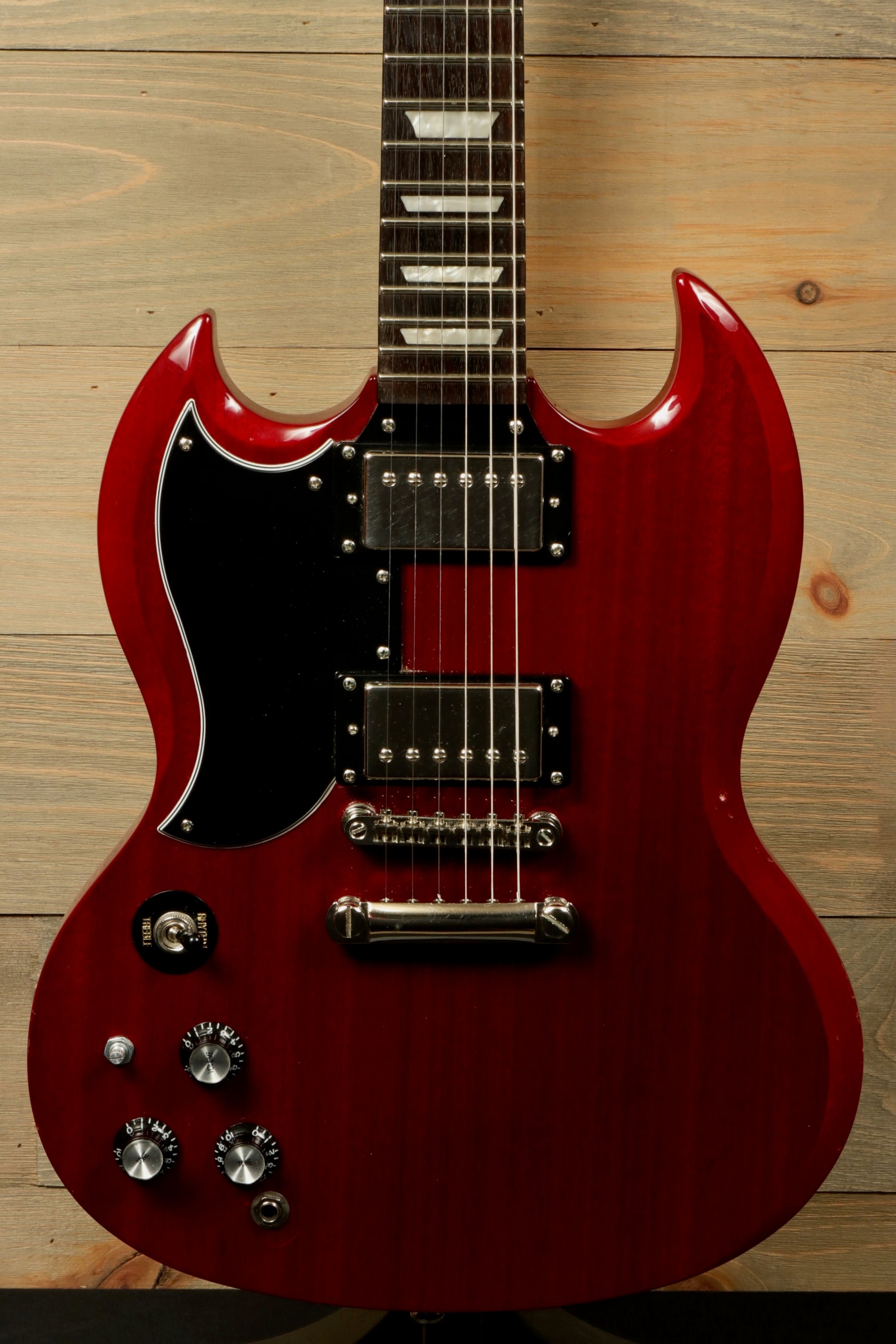 Epiphone SG Pro Left glossy red electric guitar, front view with two humbucker pickups