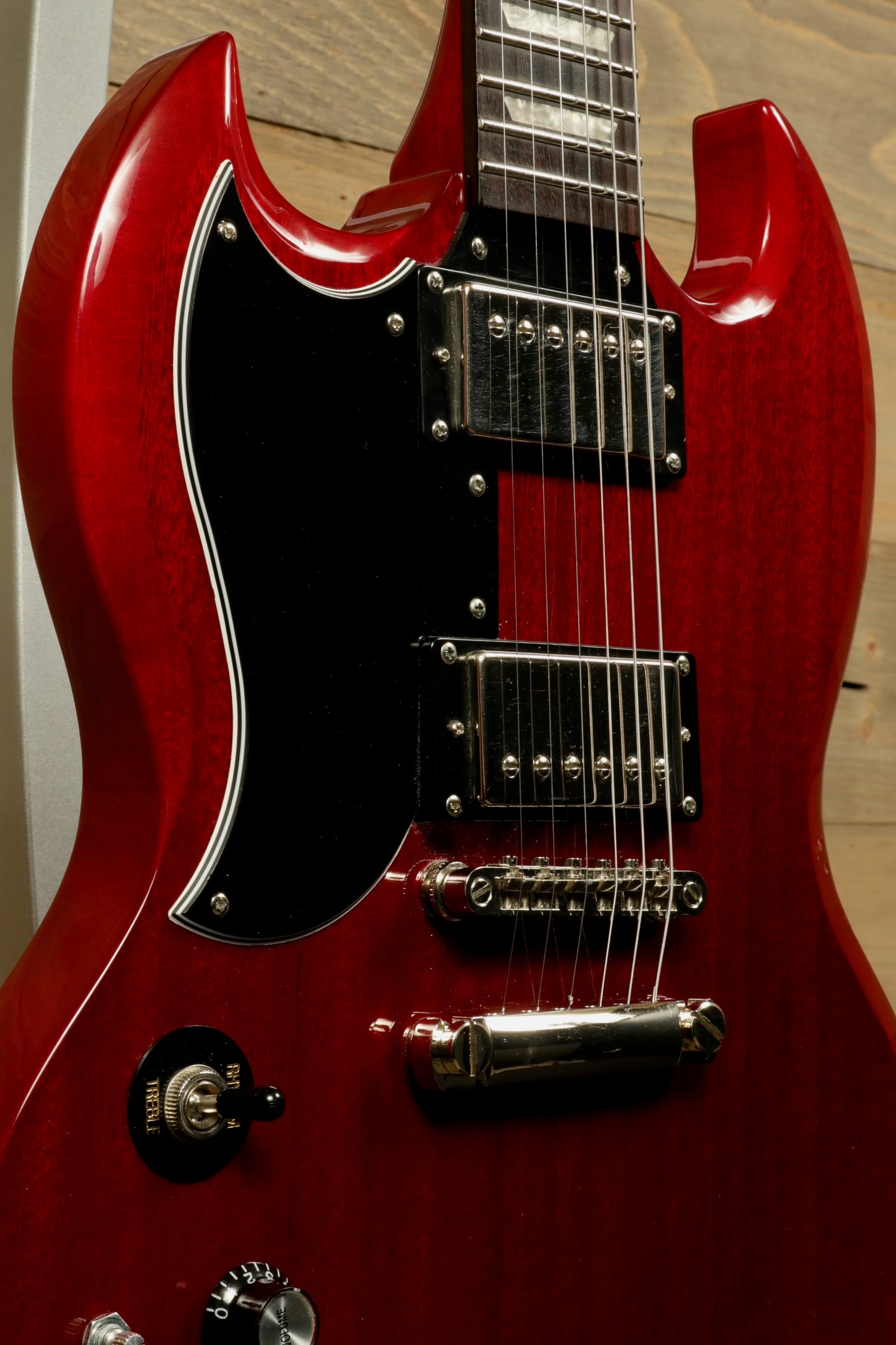 Epiphone SG Pro Left in cherry red finish, showcasing the body and pickups from a side angle