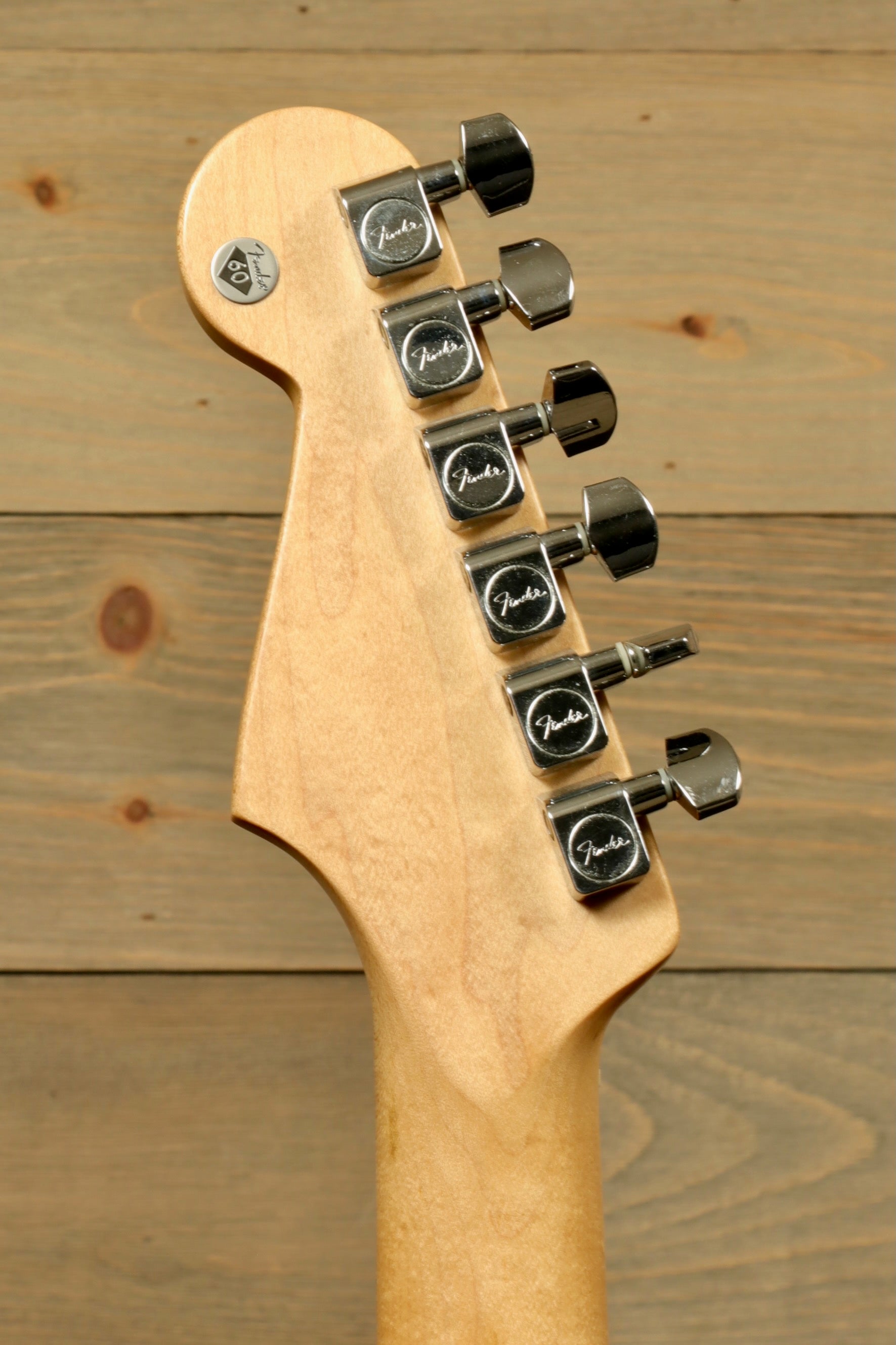Close-up of the headstock of a 2006 Fender Standard Stratocaster with Hardshell Case USED