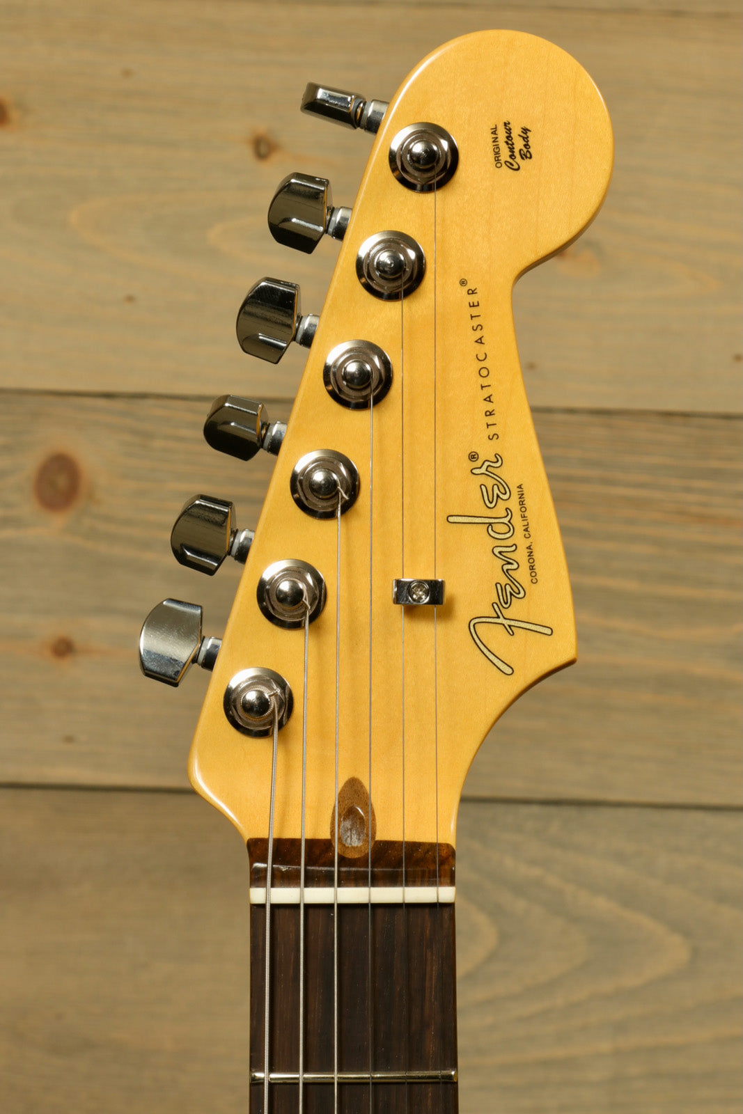 Fender American Professional II Stratocaster with Hardshell Case showcasing polished headstock and tuning pegs