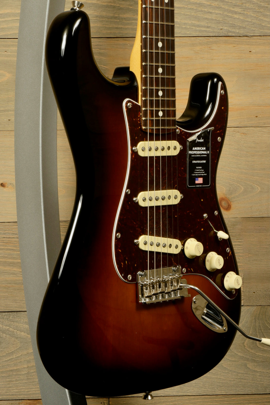 Fender American Professional II Stratocaster with Hardshell Case showcasing a sunburst finish and classic design