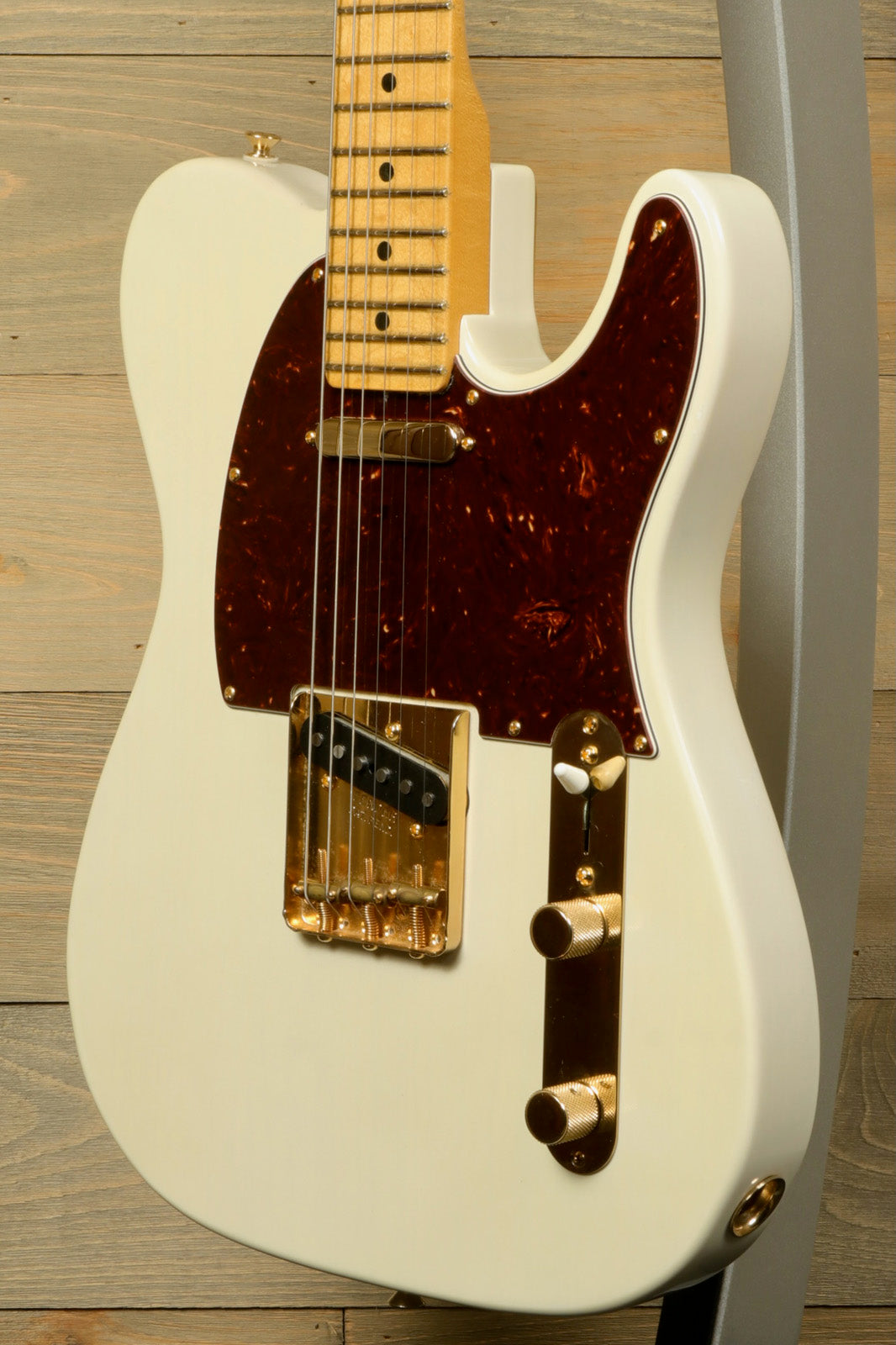 Fender Limited Edition Select Light Ash Telecaster in white with gold hardware, side view