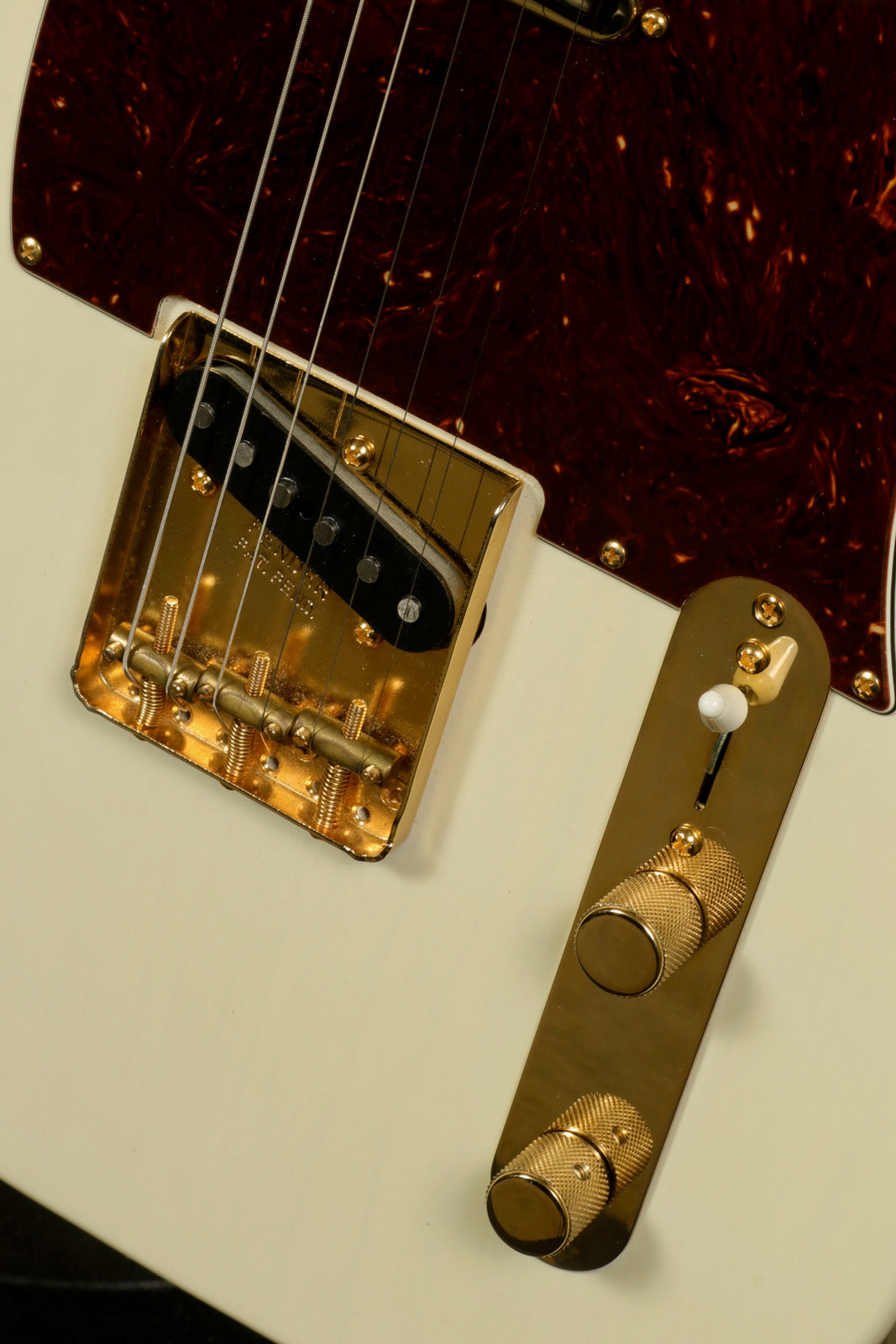 Fender Limited Edition Select Light Ash Telecaster in white, close-up view of hardware and controls