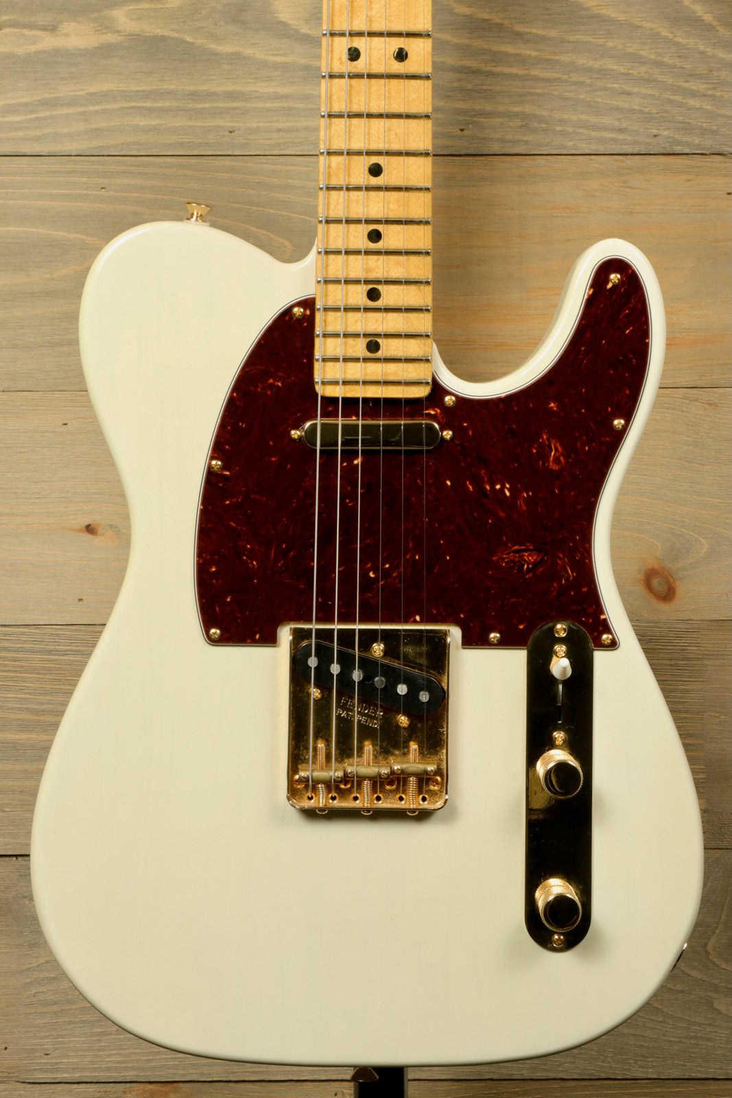 Fender Limited Edition Select Light Ash Telecaster in White, front view with maple neck and tortoiseshell pickguard