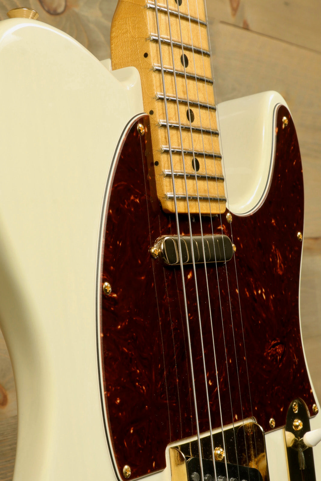 Fender Limited Edition Select Light Ash Telecaster in white with tortoise shell pickguard, side view