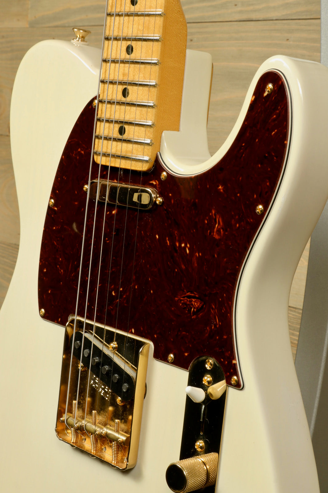 Fender Limited Edition Select Light Ash Telecaster in white with tortoiseshell pickguard, front view