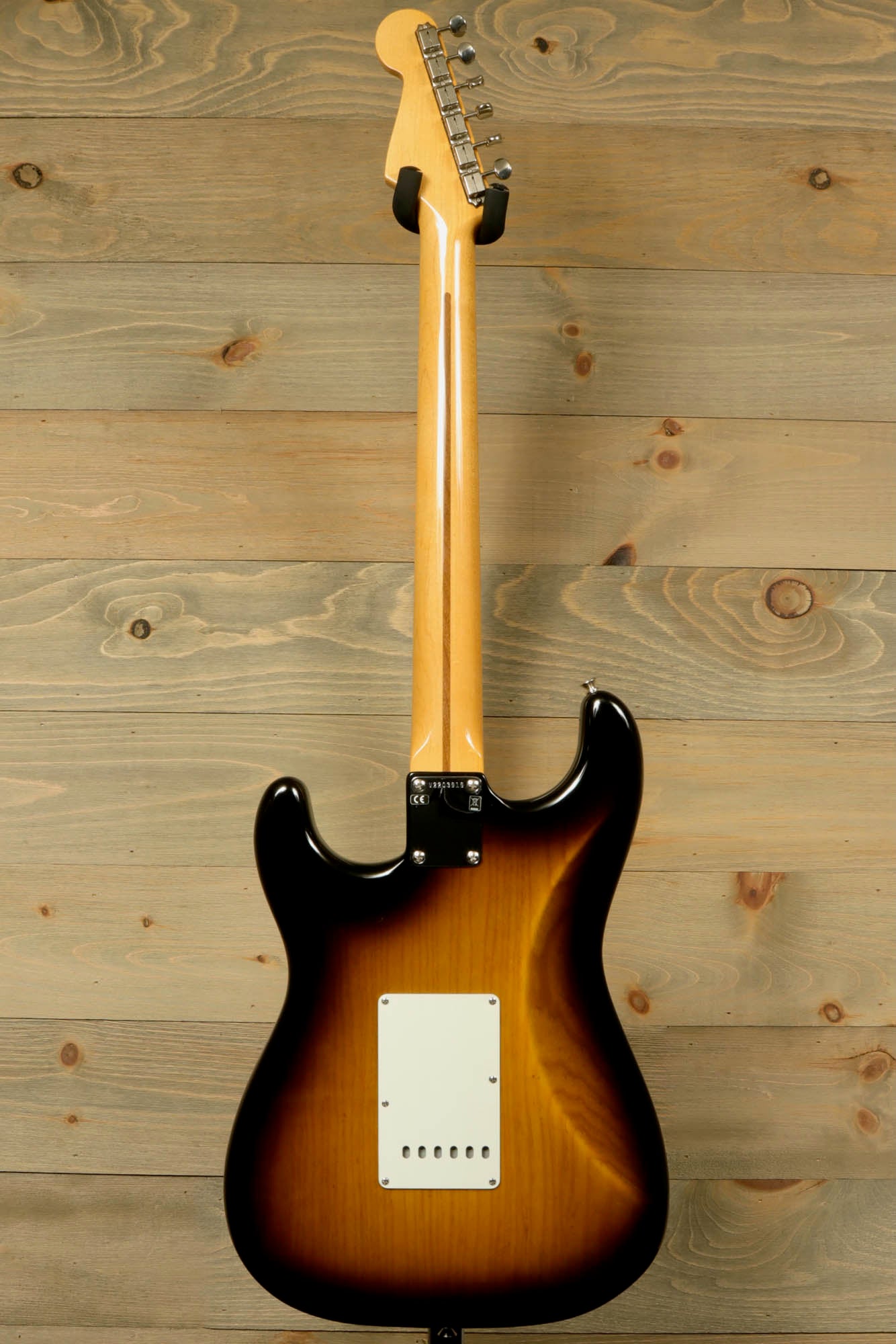 Back view of Fender Original 50's Strat with case showcasing its classic sunburst finish and sleek design
