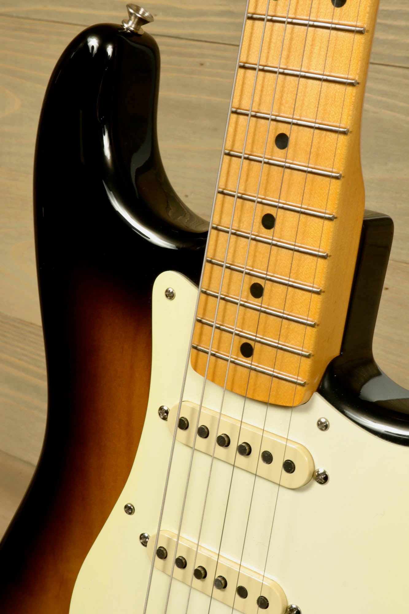 Fender Original 50's Strat with case showcasing beautiful sunburst finish and classic neck details