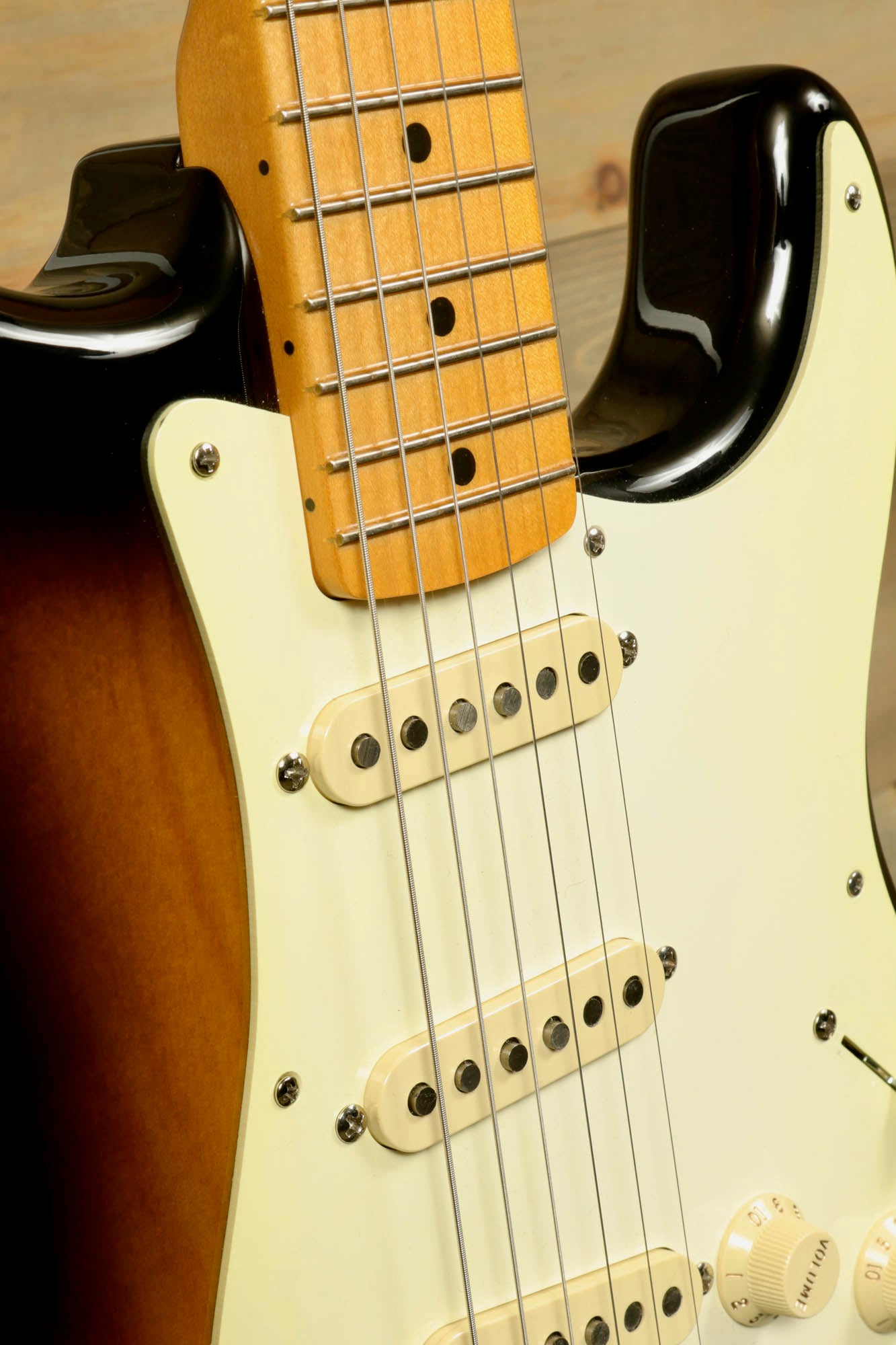 Fender Original 50's Strat with case showing a close-up of the maple neck and vintage-style pickups