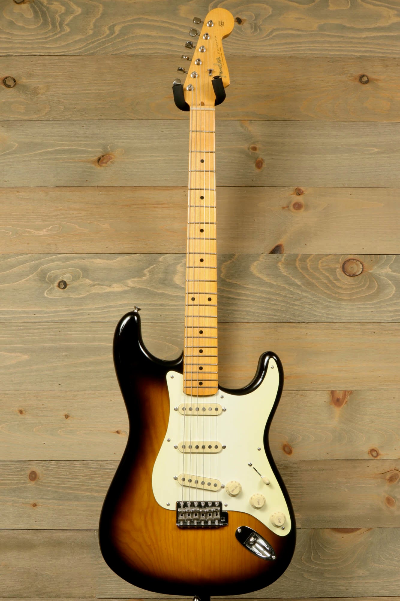 Fender Original 50's Strat with case, featuring a sunburst finish and vintage-style pickups