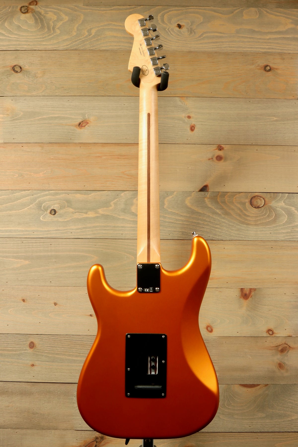 Fender Standard Stratocaster Satin Arizona Sun, rear view showcasing the sleek orange finish