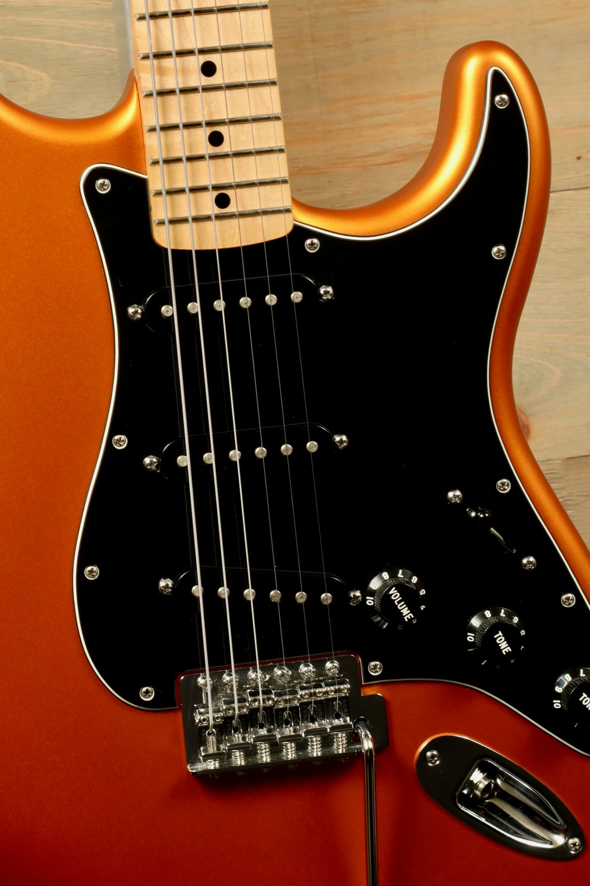 Fender Standard Stratocaster Satin Arizona Sun, close-up view showcasing fretboard and control knobs