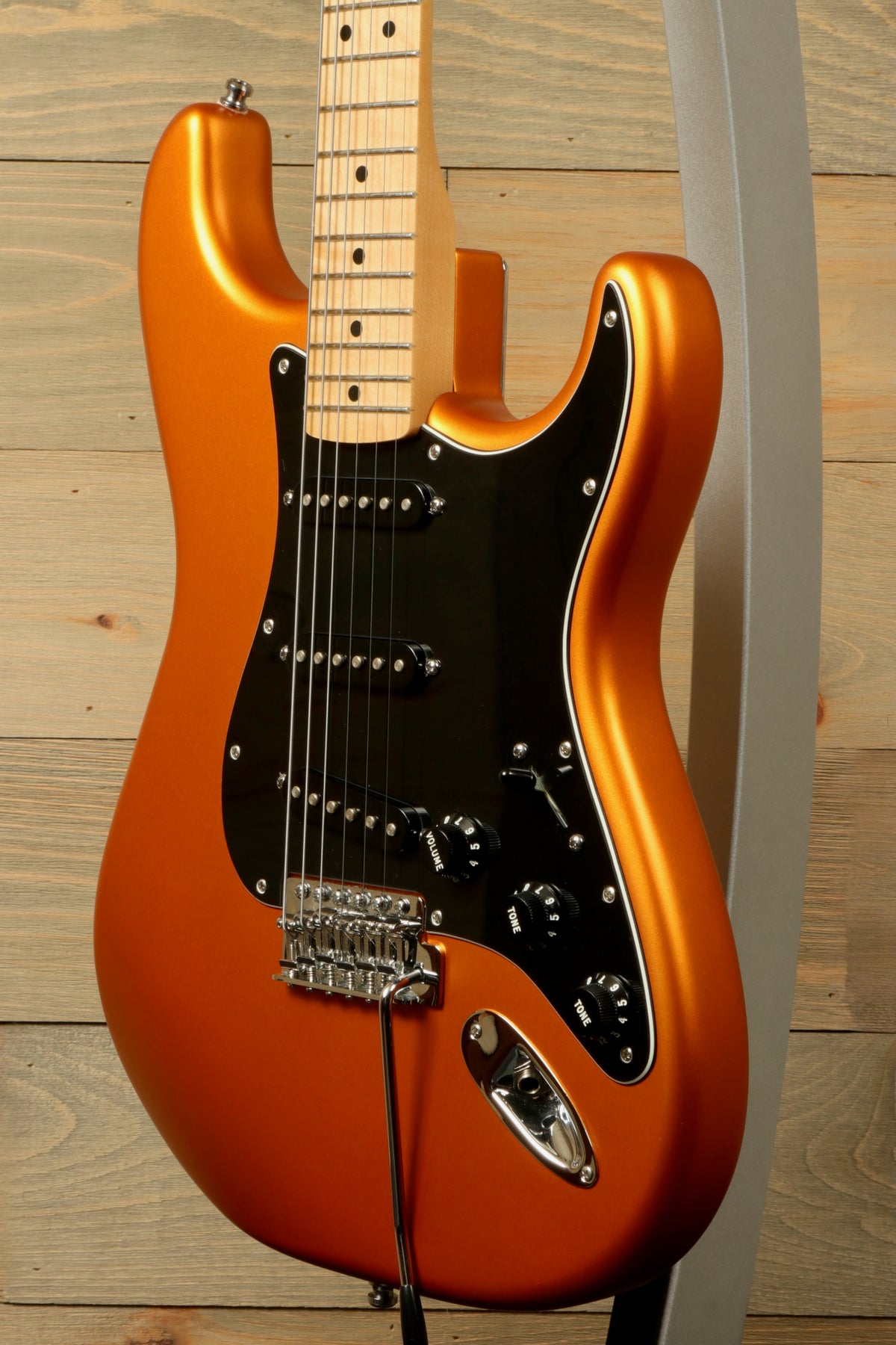 Fender Standard Stratocaster Satin Arizona Sun, side view showing the vibrant orange finish