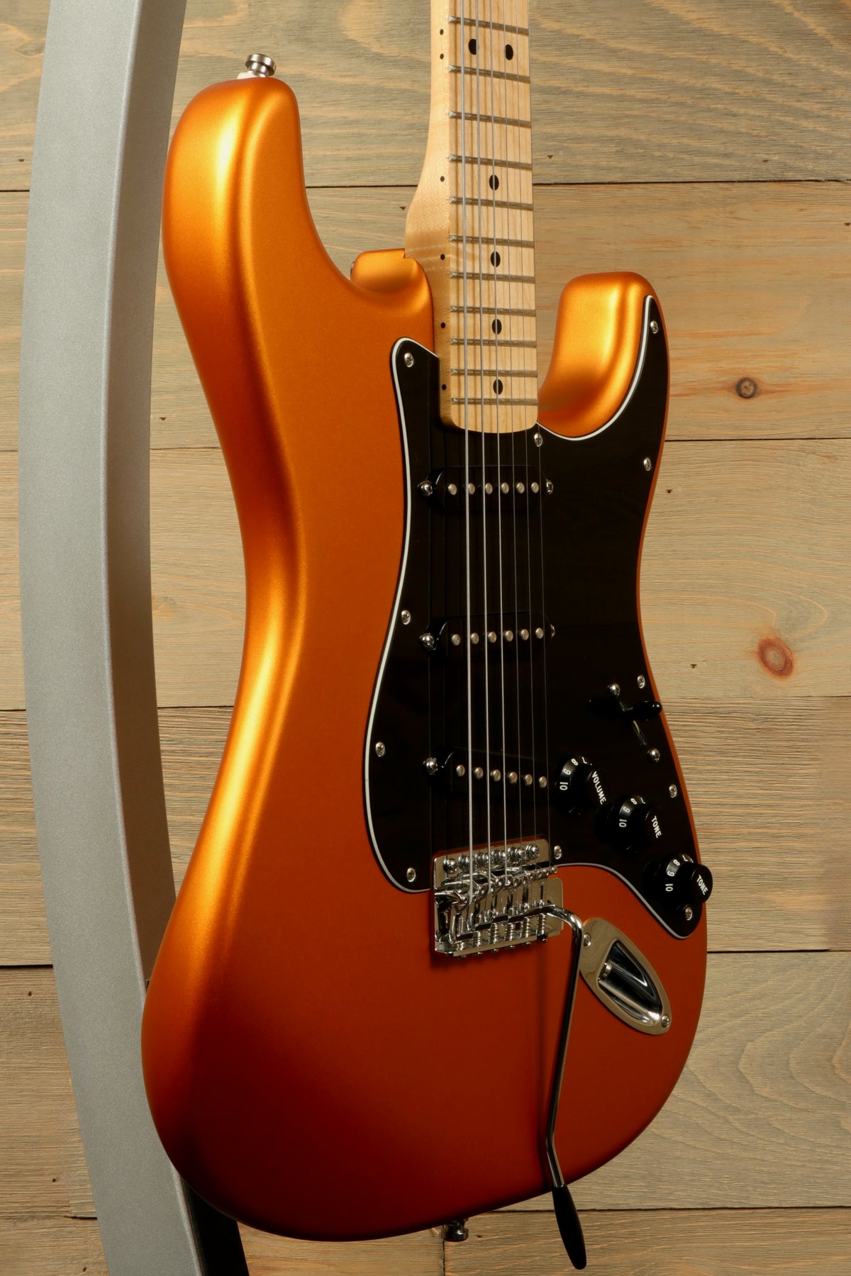 Fender Standard Stratocaster Satin Arizona Sun, side view showcasing its sleek finish and black hardware
