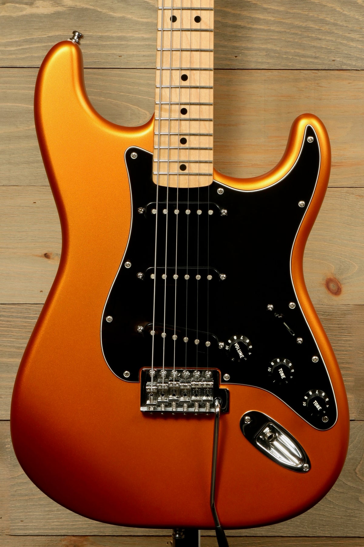Fender Standard Stratocaster Satin Arizona Sun electric guitar, front view with black pickguard.