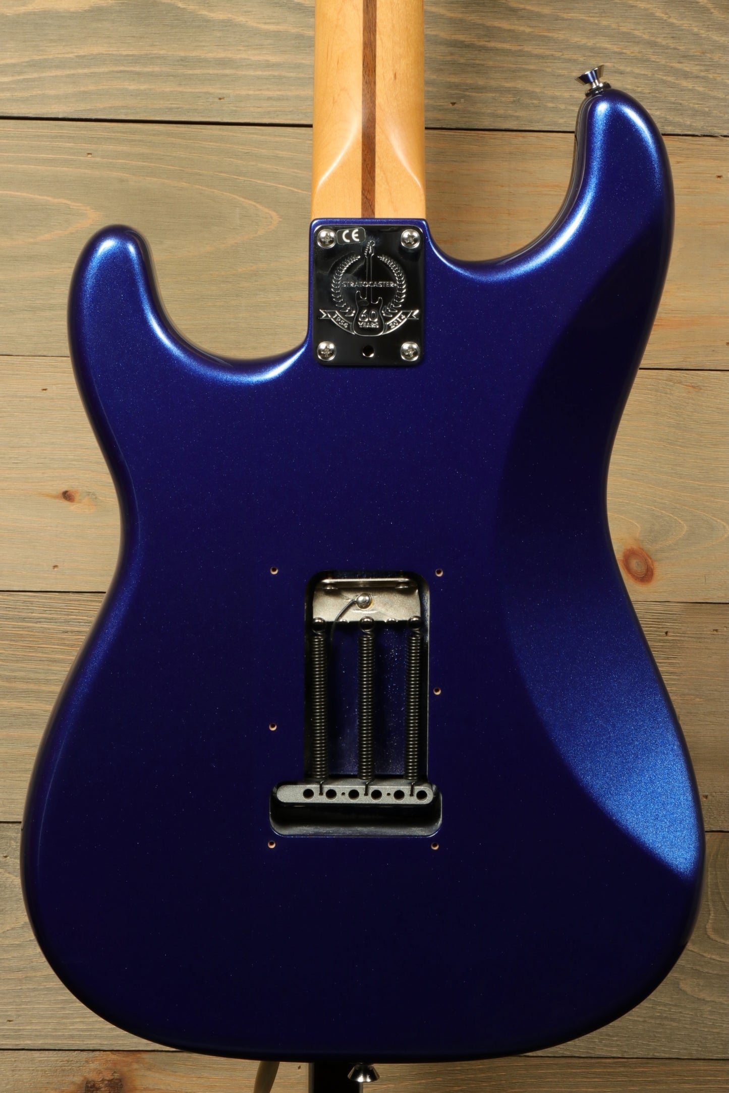 Back view of a used Fender American Standard Stratocaster HSS in dark blue with a smooth finish