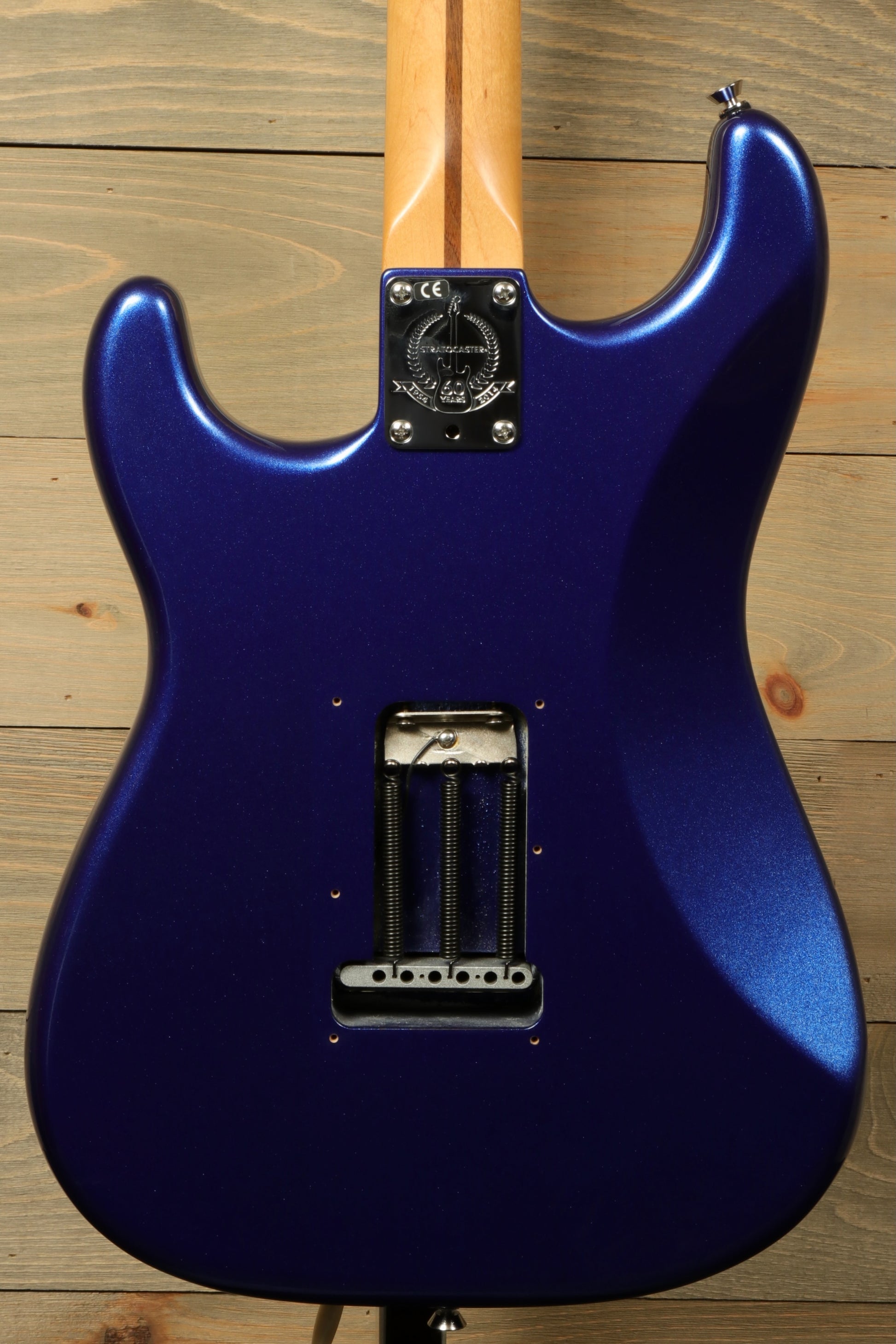 Back view of a used Fender American Standard Stratocaster HSS in dark blue with a smooth finish