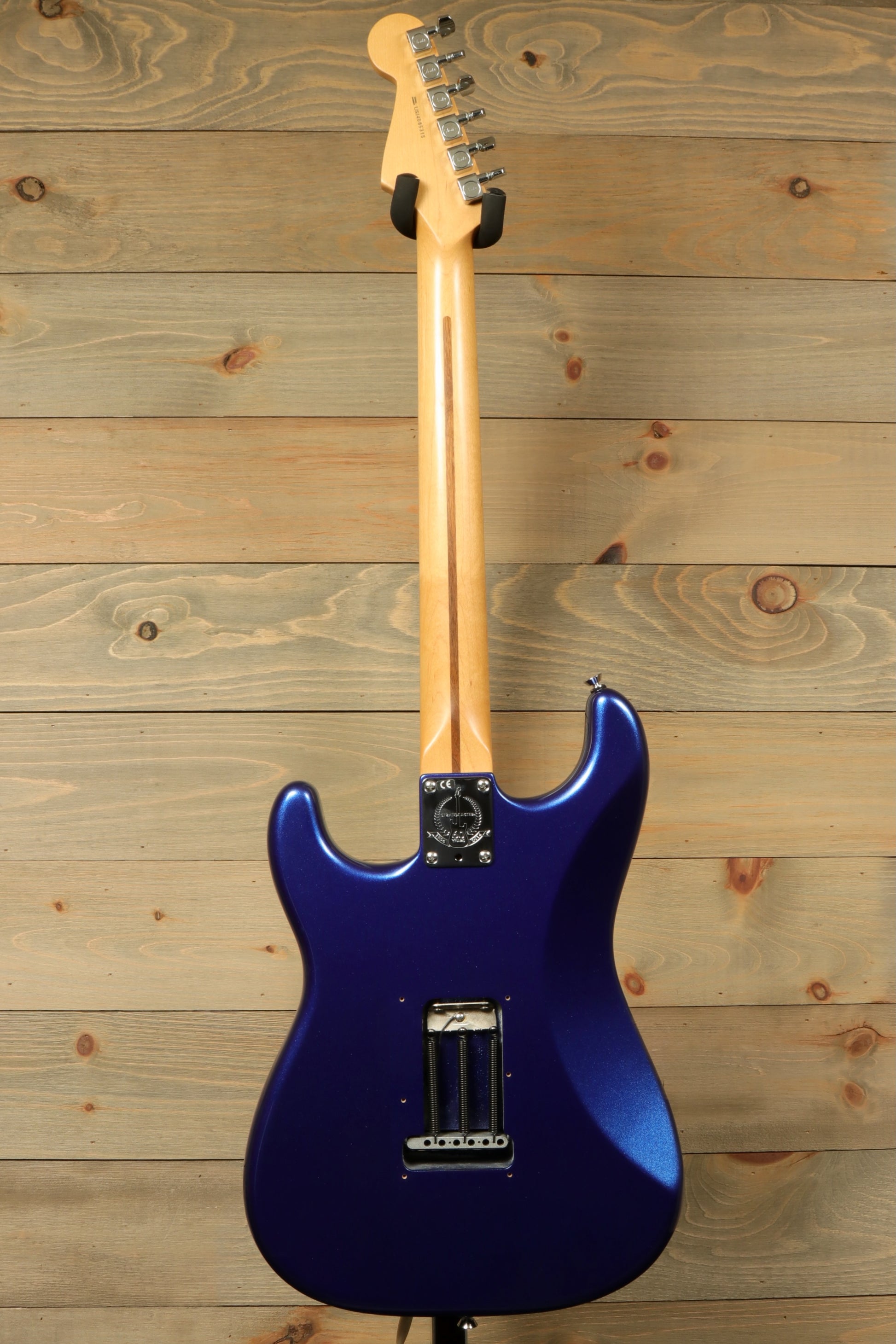 Back view of a used Fender American Standard Stratocaster HSS in striking blue with sleek design