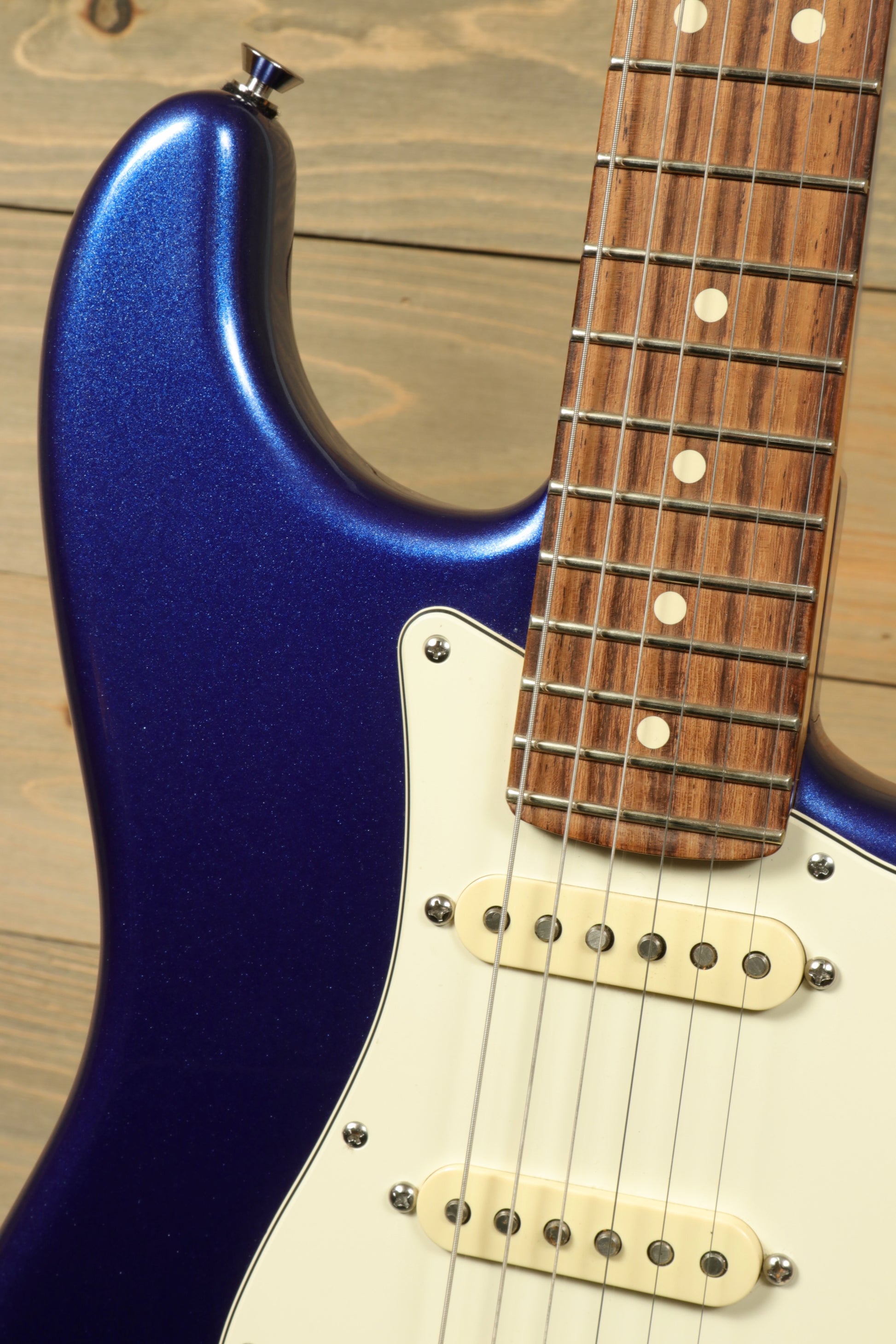 Close-up of used Fender American Standard Stratocaster HSS with a stunning blue finish and rosewood fretboard