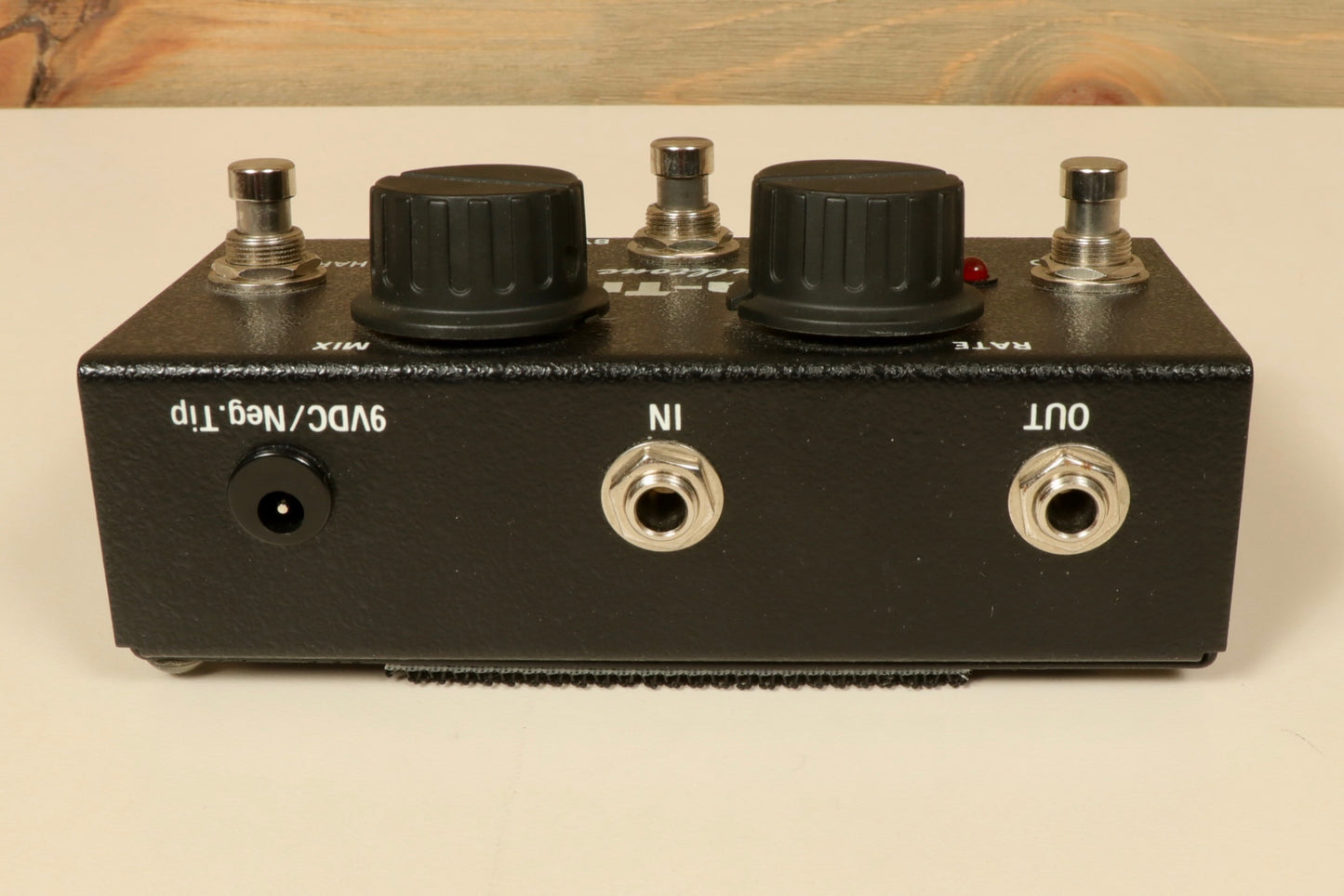 Fulltone SupaTrem black effects pedal, top view with knobs and input/output jacks