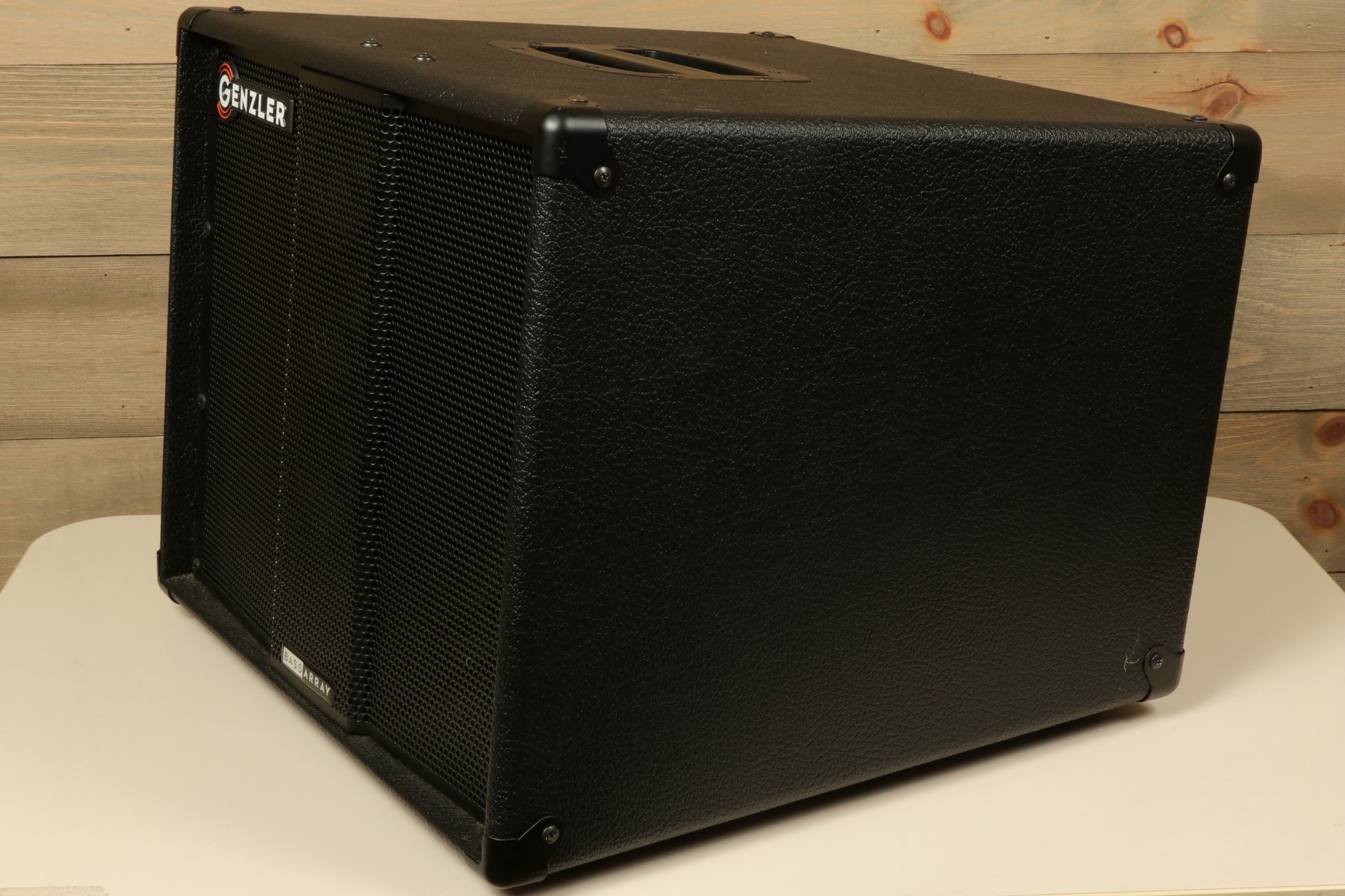 Genzler bass cabinet, black finish, angled view showcasing speaker grille and control panel