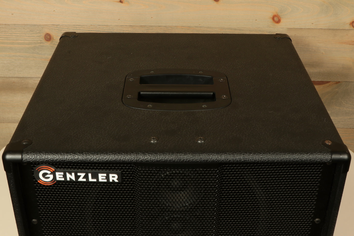 Genzler bass cabinet in black, top view showcasing sturdy handle and speaker grille