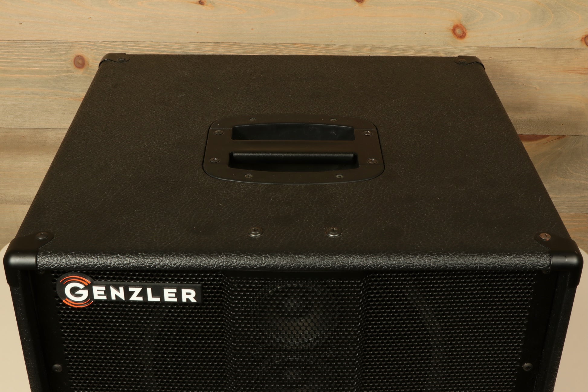Genzler bass cabinet in black, top view showcasing sturdy handle and speaker grille