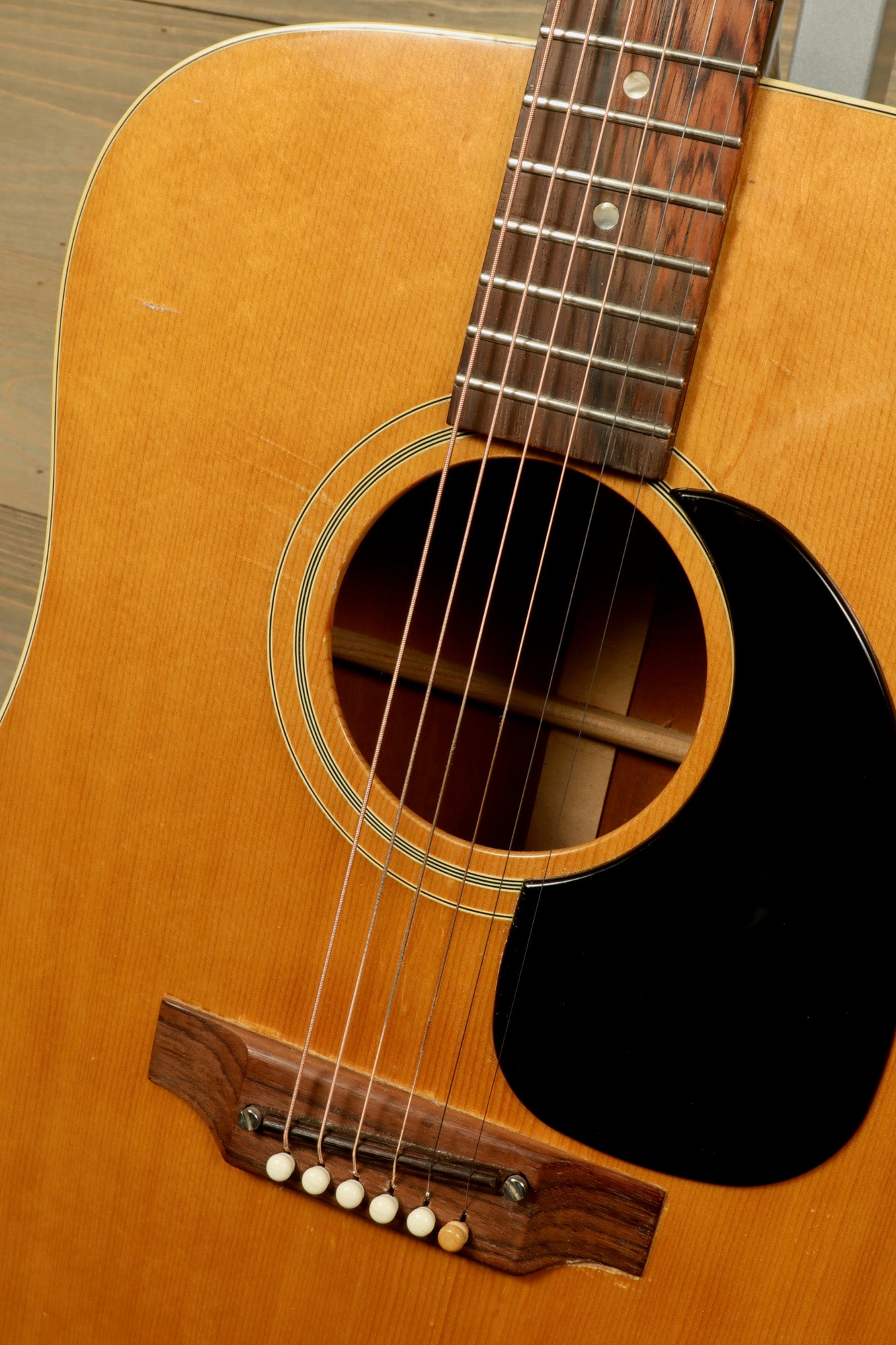 1968 Gibson J-50 Deluxe for sale showcasing a classic acoustic guitar body and rosewood fingerboard