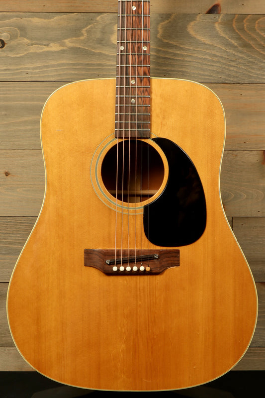 1968 Gibson J-50 Deluxe for sale. Vintage acoustic guitar with natural finish and classic design.