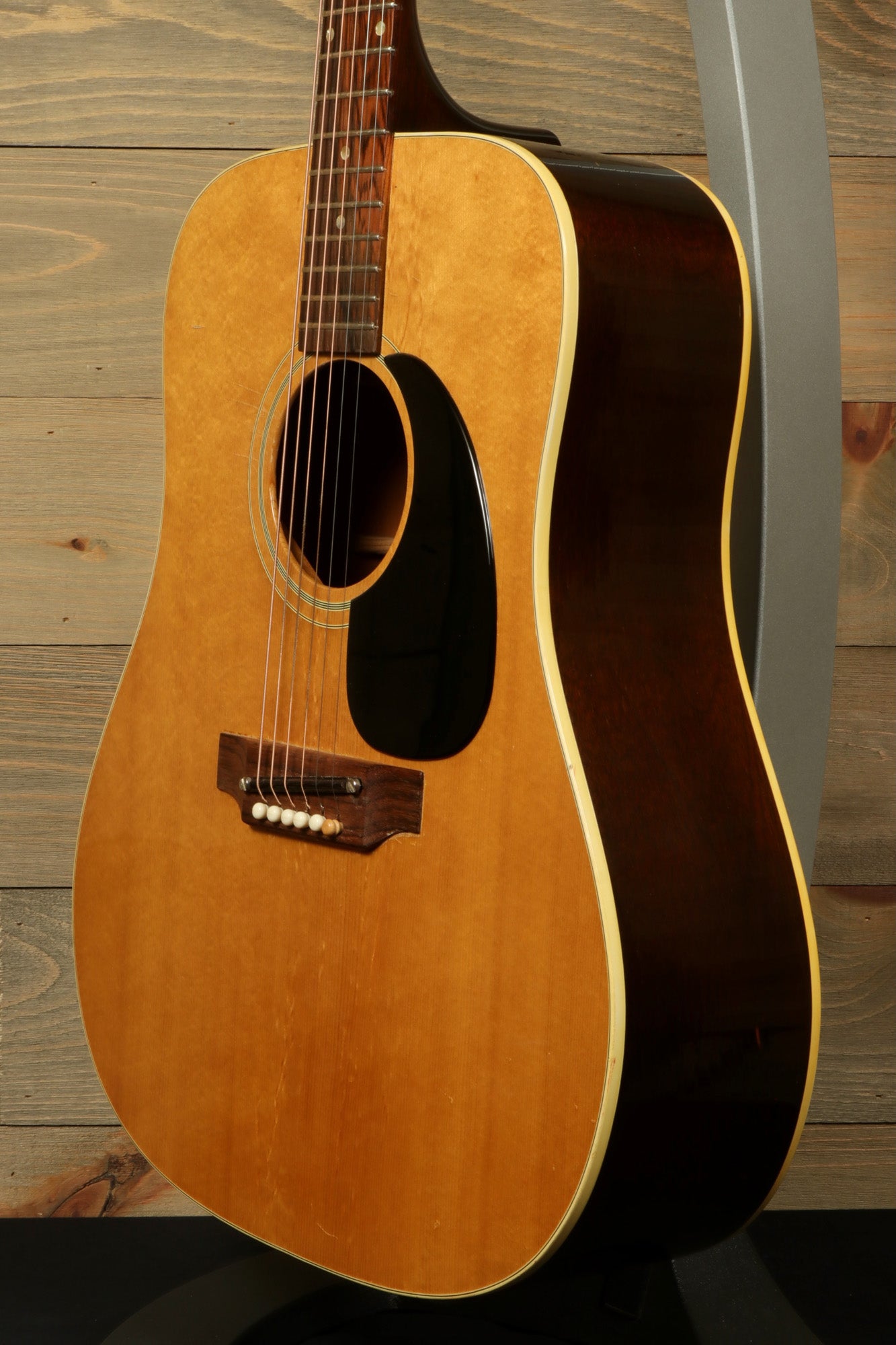 1968 Gibson J-50 Deluxe for sale featuring a classic sunburst finish and vintage acoustic design
