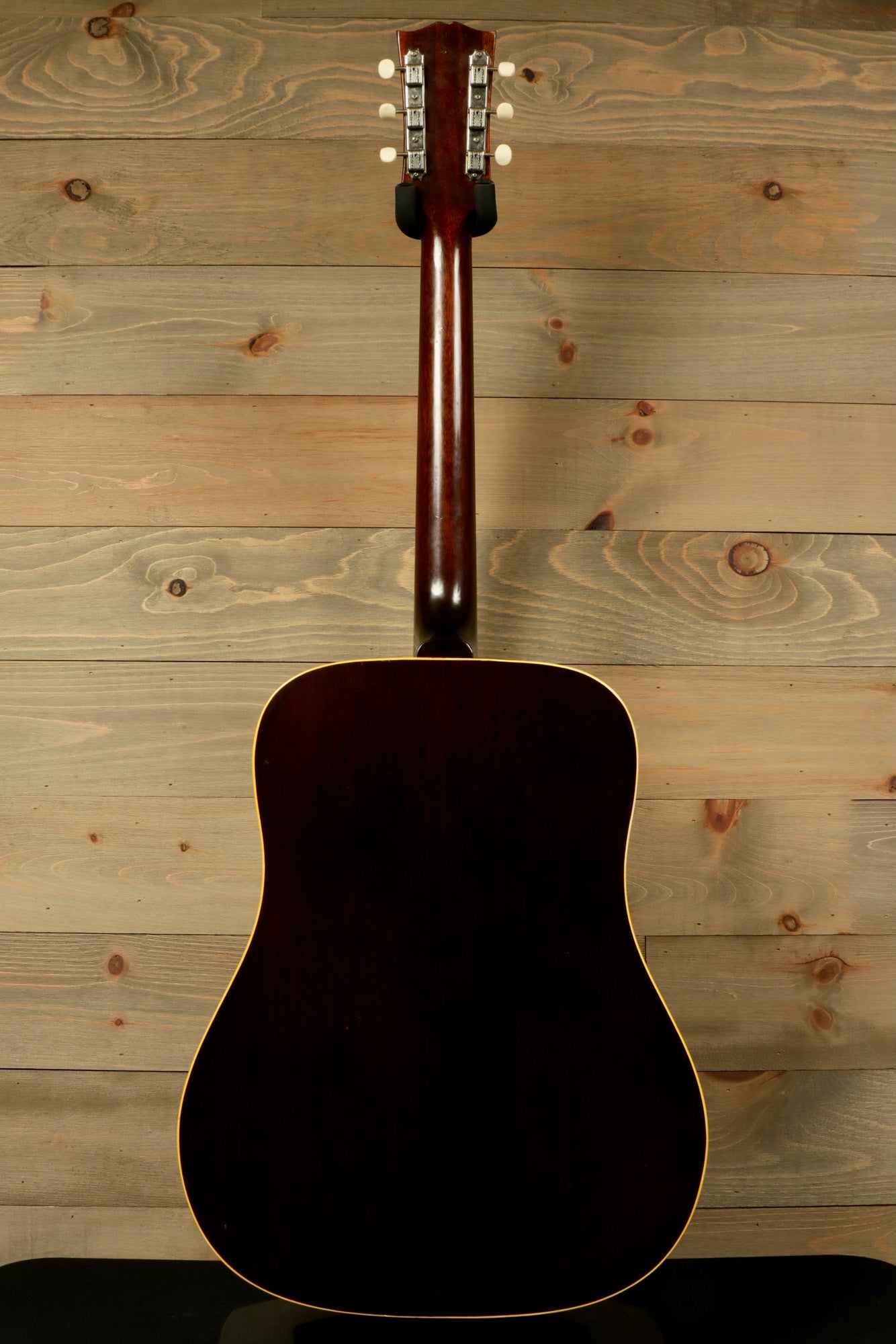 Back view of a 1968 Gibson J-50 Deluxe for sale featuring a classic design and smooth finish