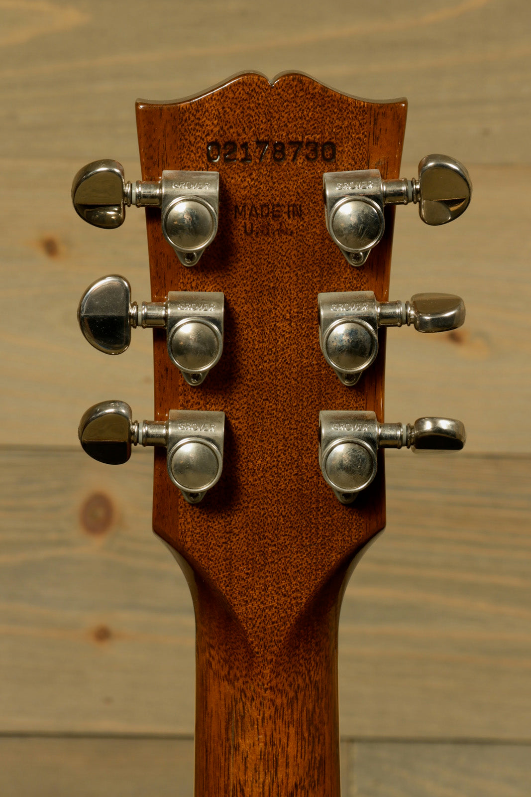 Back view of Gibson custom gibson es-335 with detailed tuners and smooth mahogany neck finish
