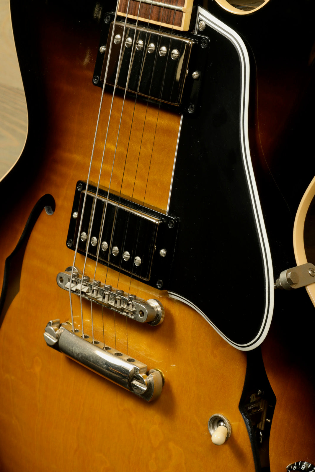 Custom Gibson ES-335 sunburst finish, front view highlighting the body and pickups