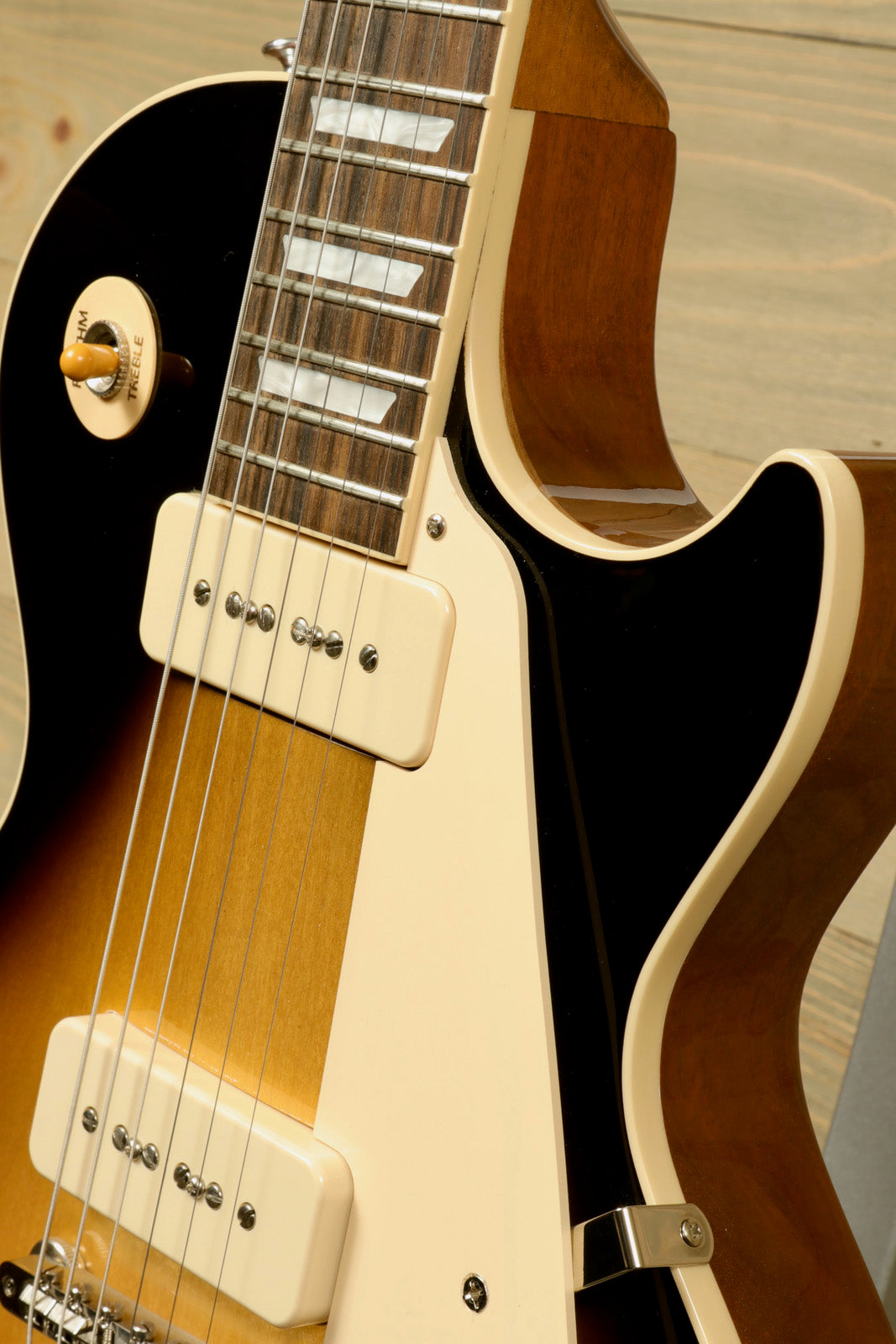 Gibson Les Paul Standard 50s P-90 in sunburst finish, close-up view of the body and neck